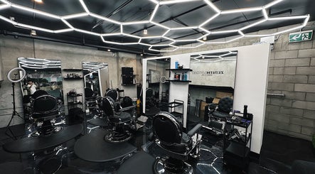 Stylish interior of Zenith Lounge Barber & Cafe Kelvin Grove, Kelvin Grove, Queensland, AU with modern barber chairs.