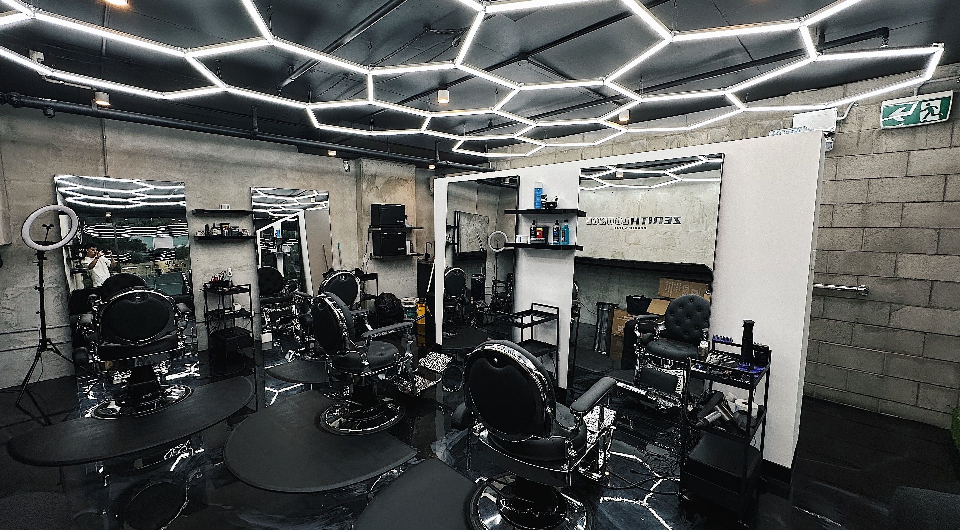 Stylish interior of Zenith Lounge Barber & Cafe Kelvin Grove, Kelvin Grove, Queensland, AU with modern barber chairs.