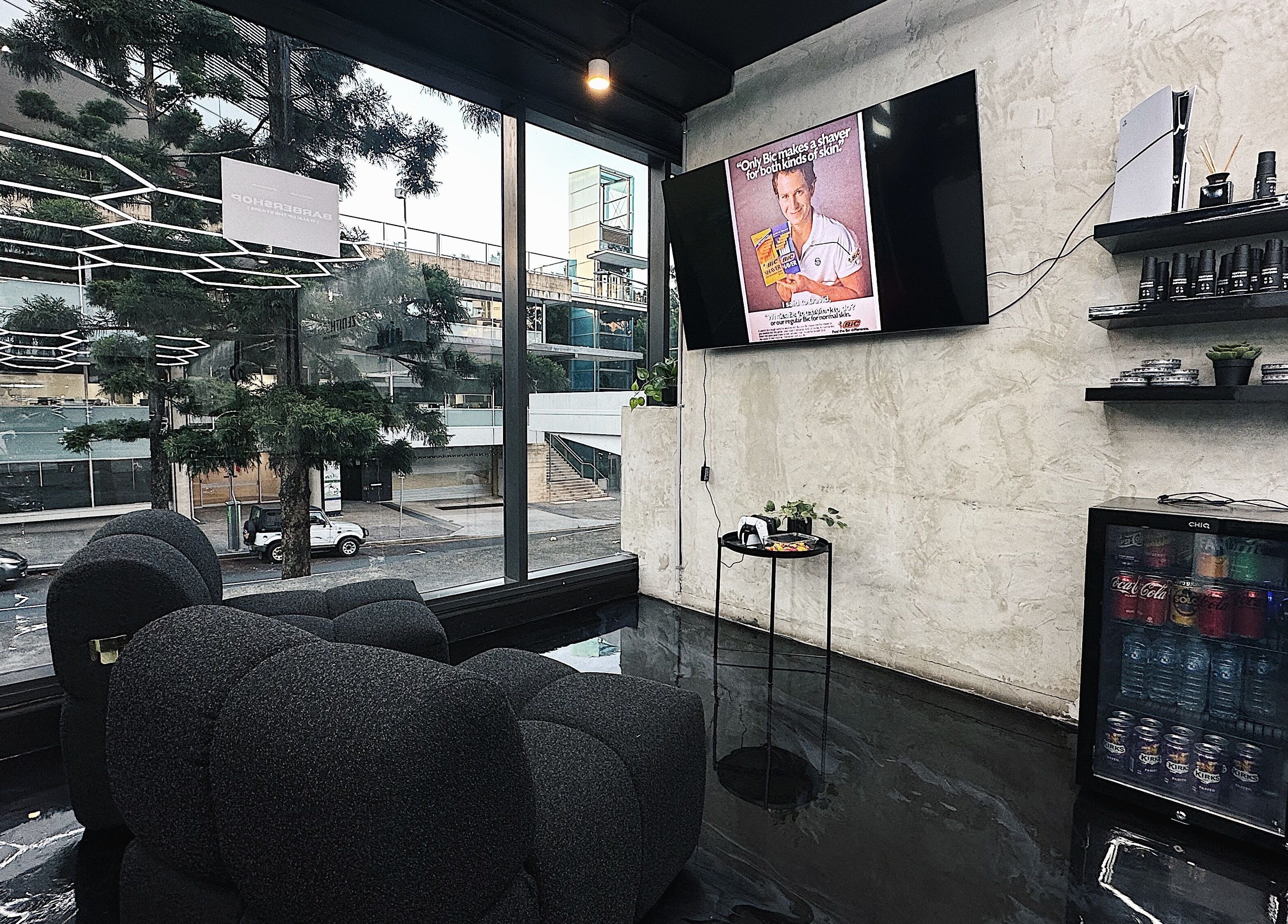 Chic interior of Zenith Lounge Barber & Cafe Kelvin Grove, featuring modern decor and street view in Queensland, AU.