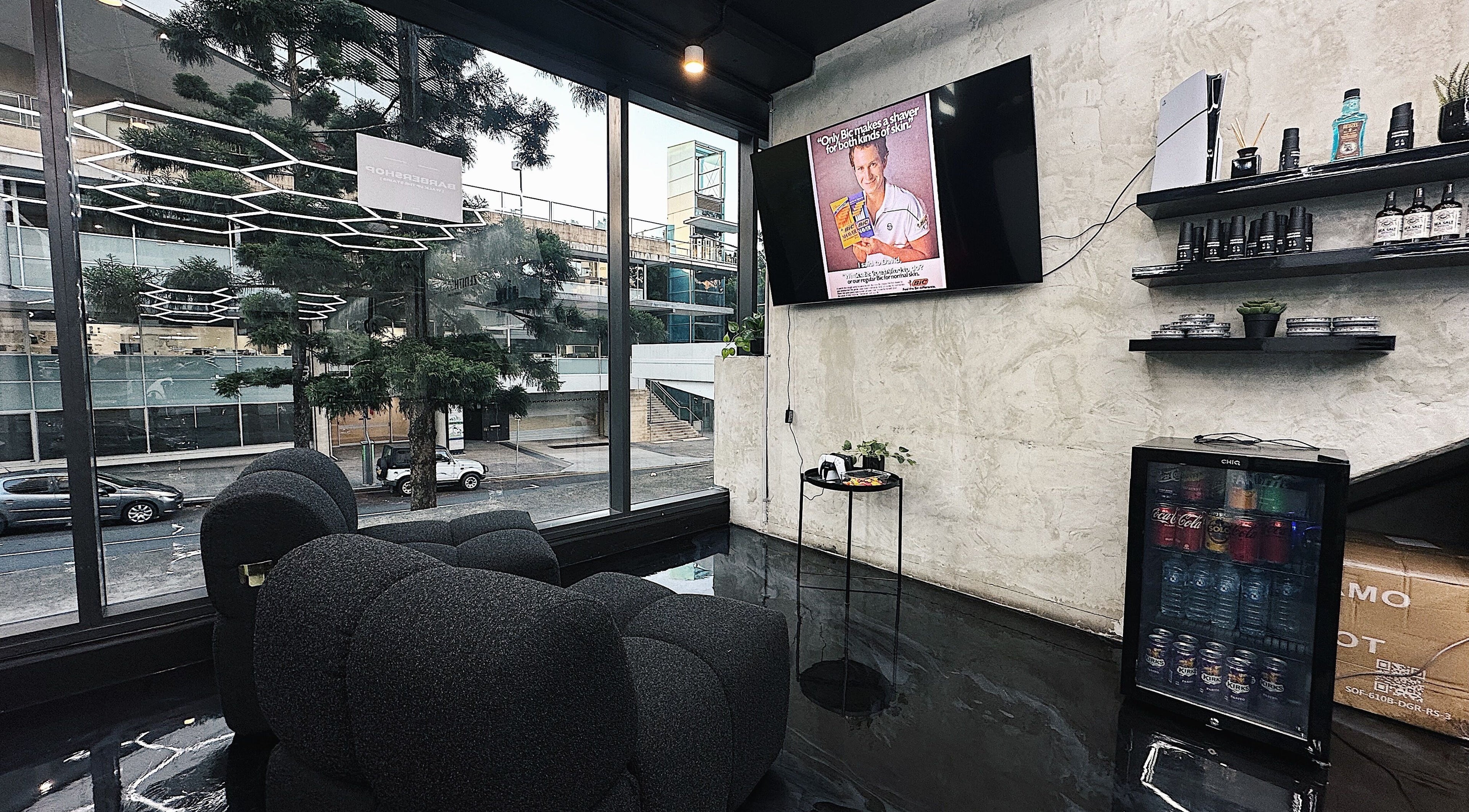Chic interior of Zenith Lounge Barber & Cafe Kelvin Grove, featuring modern decor and street view in Queensland, AU.