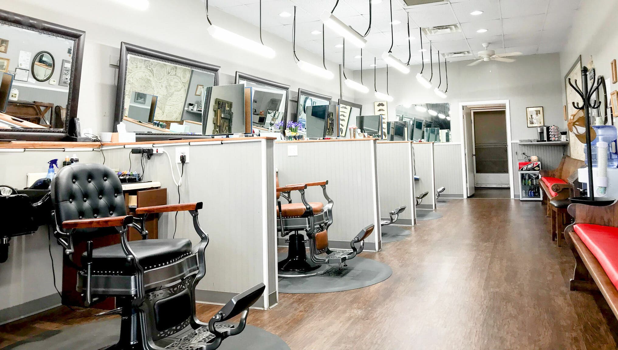 Interior of CDO Barbershop, modern barbershop chairs in Tucson, Arizona, US, showcasing elegant decor.