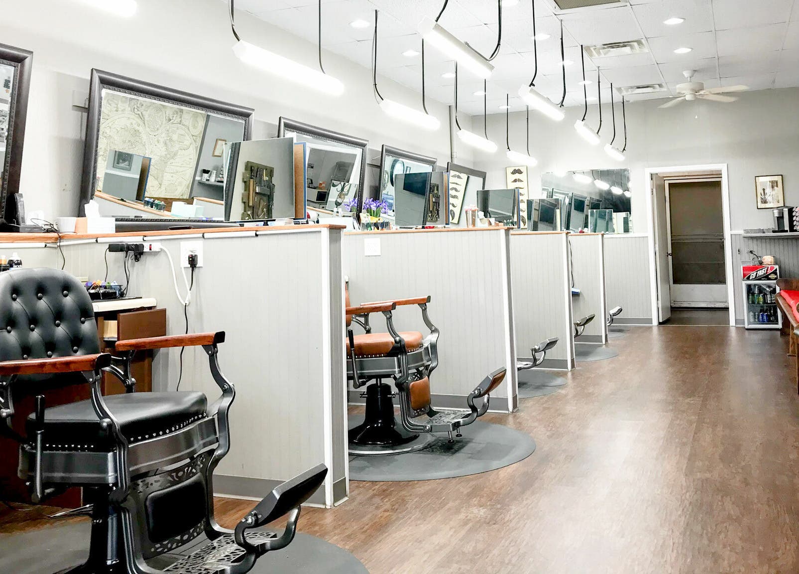 Interior of CDO Barbershop, modern barbershop chairs in Tucson, Arizona, US, showcasing elegant decor.