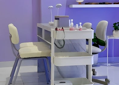 Modern nail station at NAILSUNSHINE, Bali, Bali, ID with soothing lavender decor and sleek furnishings.