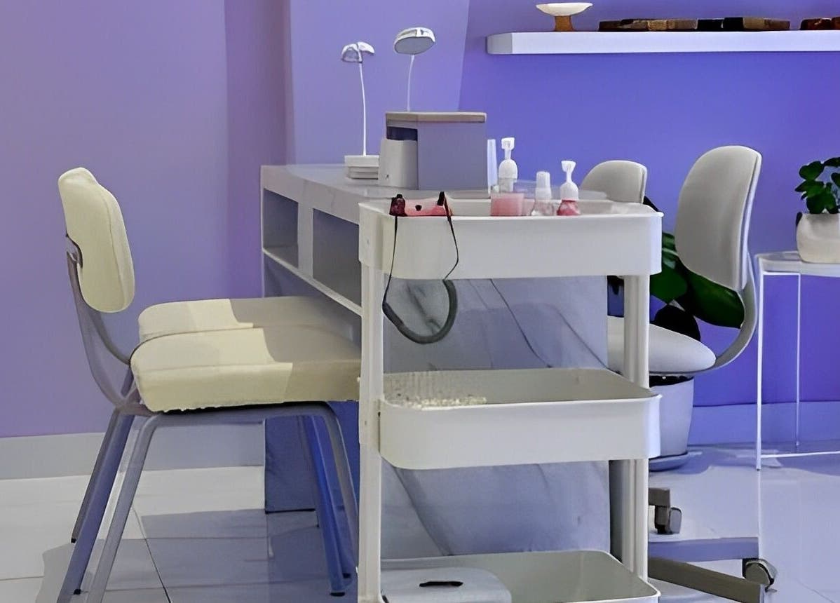 Modern nail salon at NAILSUNSHINE, Bali, Bali, ID featuring sleek workstations and calming purple walls.