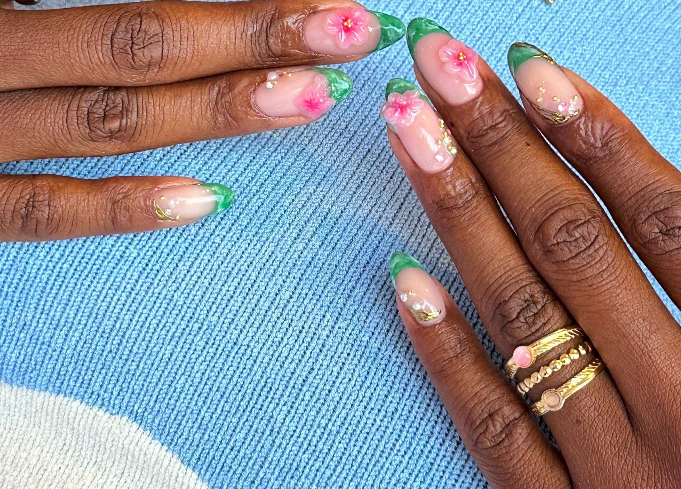 Elegant floral nail art design at NAILSUNSHINE, Bali, Bali, ID, showcasing delicate pink blossoms.
