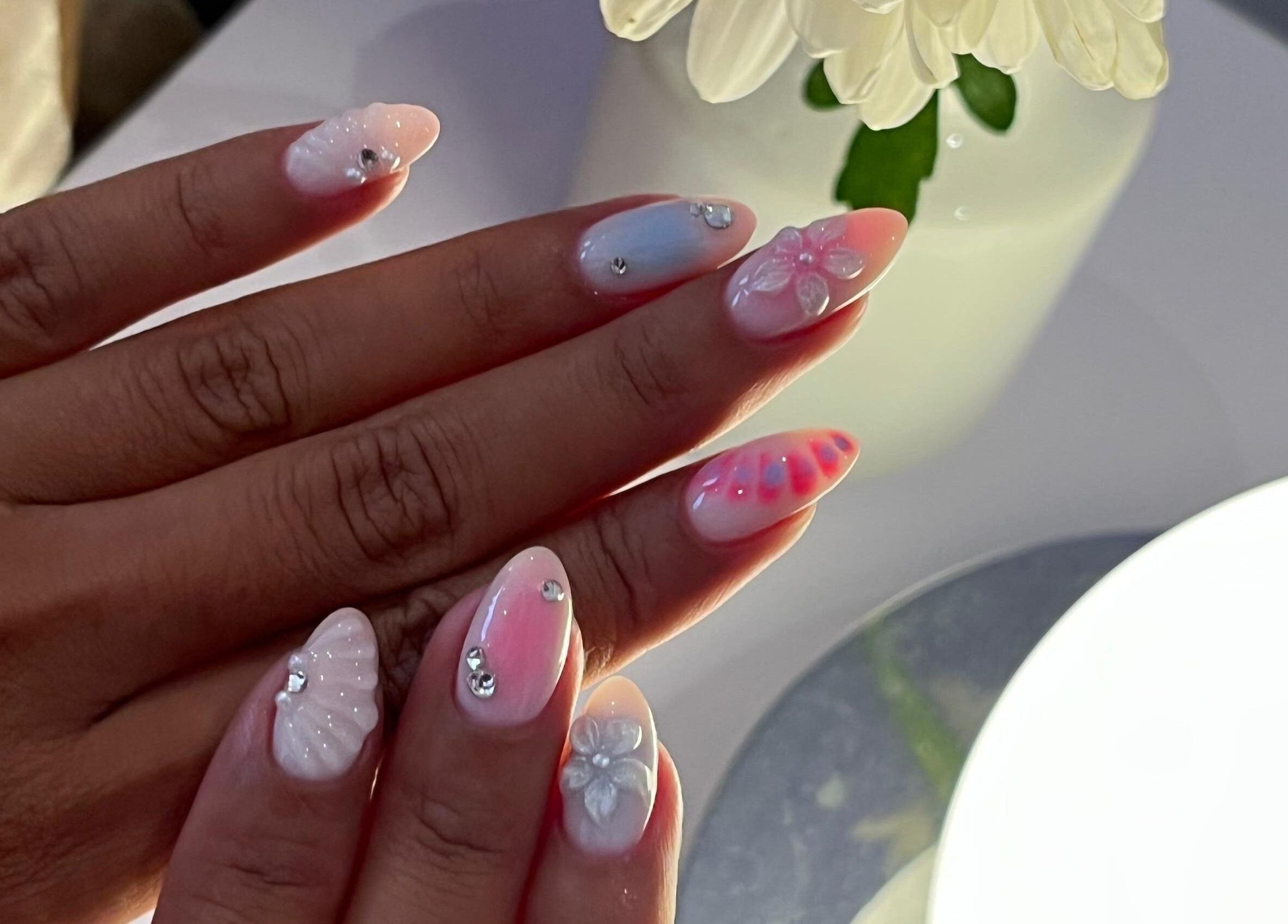 Elegant floral and gemstone nail art at NAILSUNSHINE, Bali, Bali, ID perfect for chic styling.