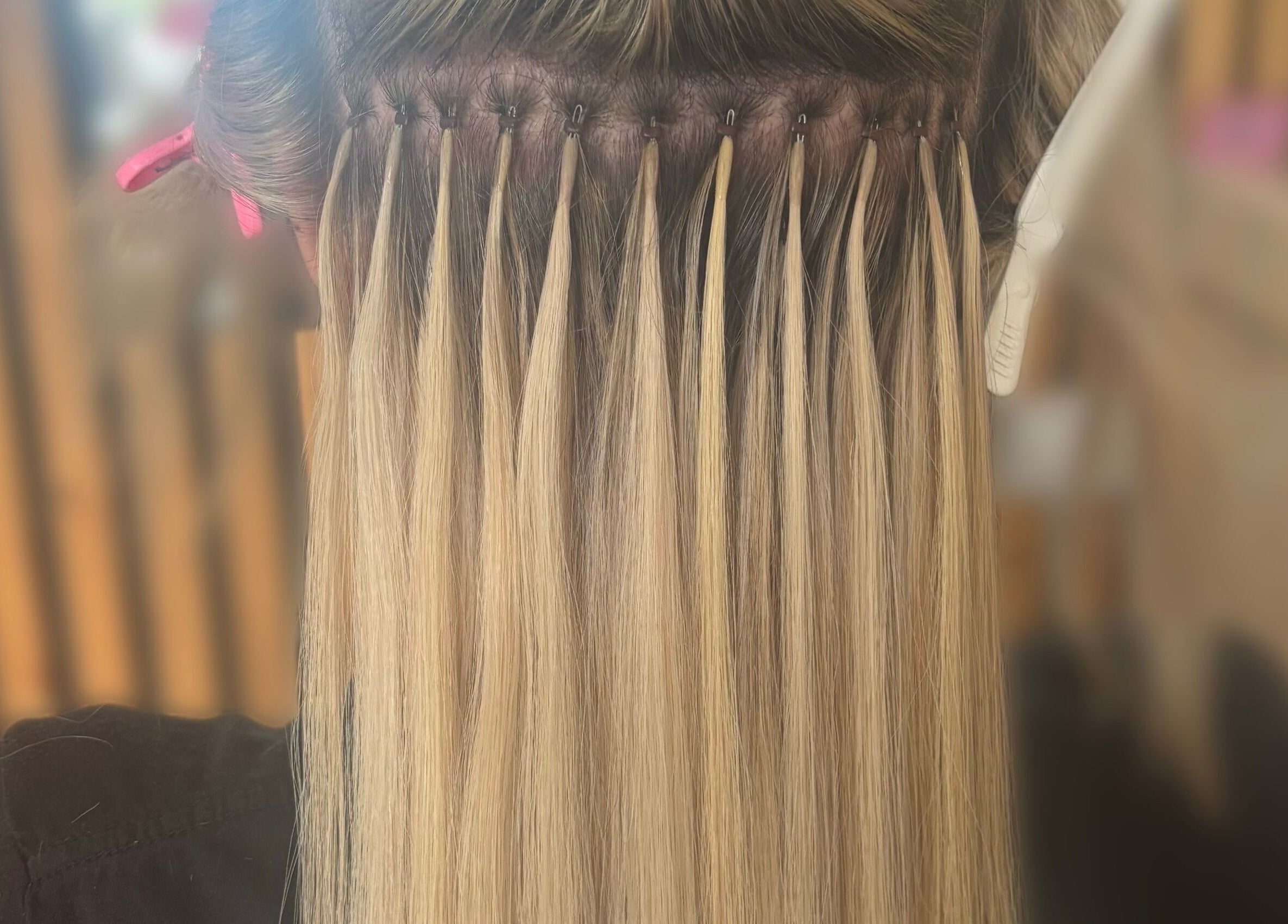 Hair extensions process at Sweetie Hairdressing in Blythe Bridge, England, GB showcasing expert techniques.