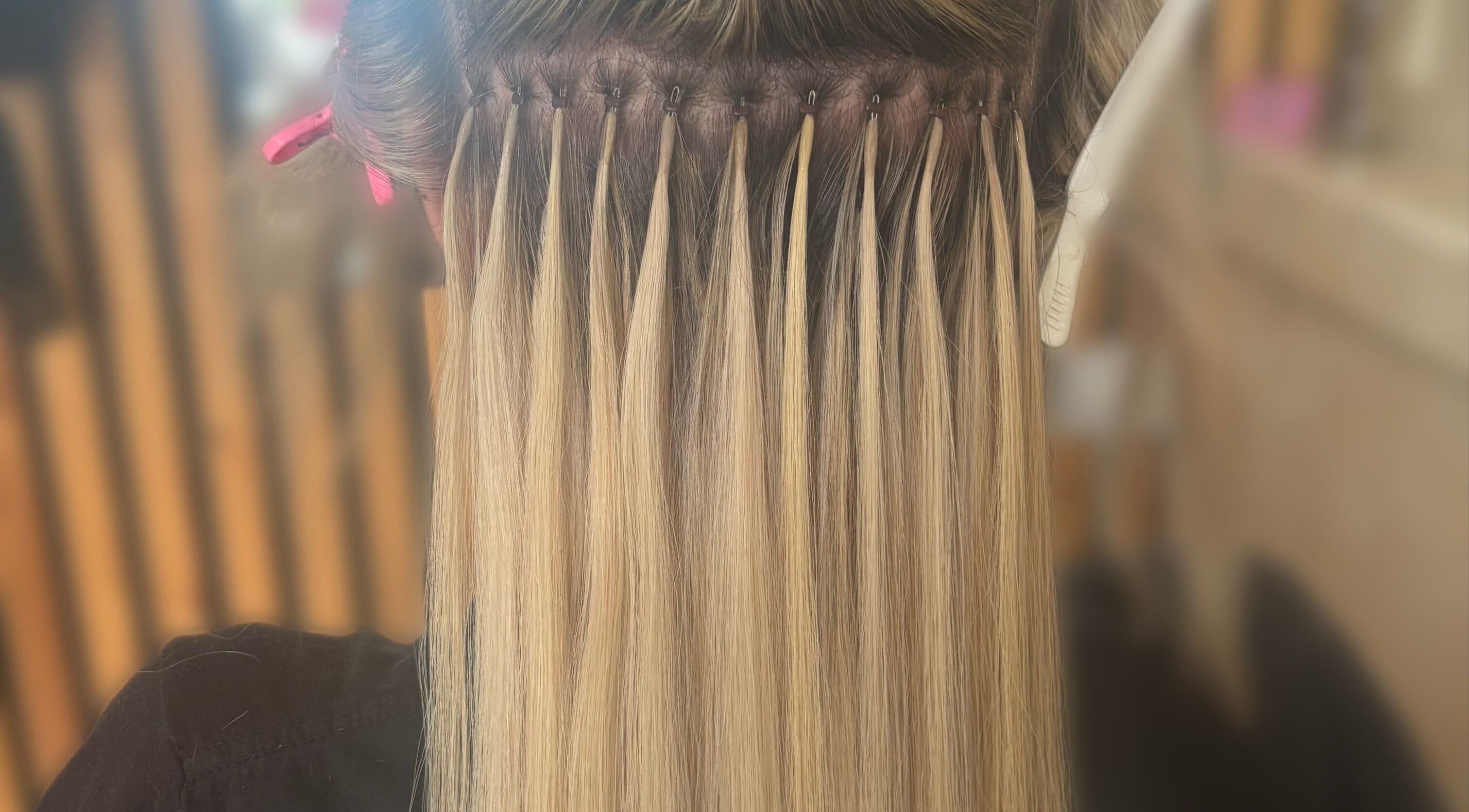 Hair extensions process at Sweetie Hairdressing in Blythe Bridge, England, GB showcasing expert techniques.