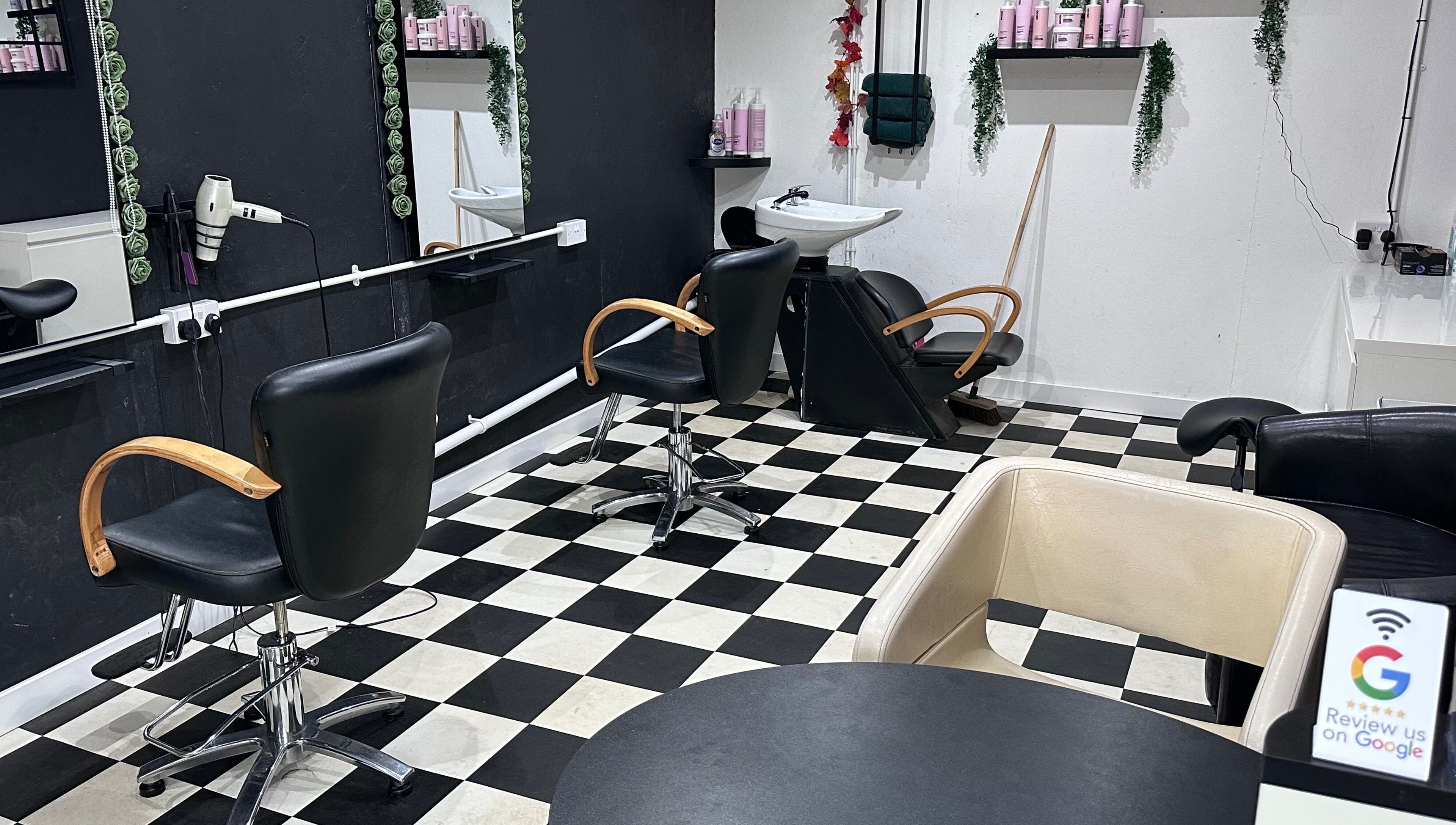 Modern styling chairs at Locks on the Levels, Middlezoy, England, GB. Elegant black and white decor.