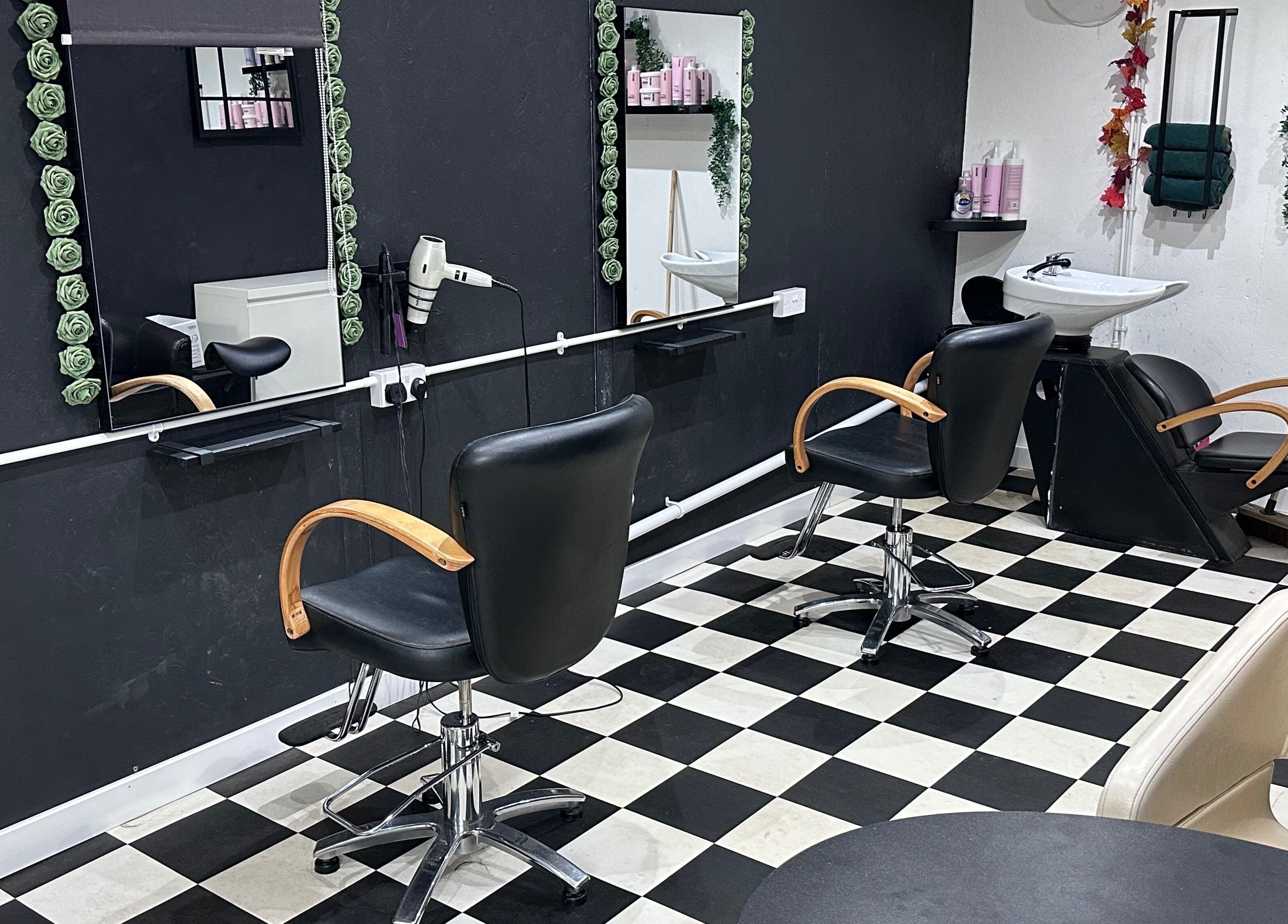 Chic interior of Locks on the Levels salon in Middlezoy, England, GB with modern black and white decor.
