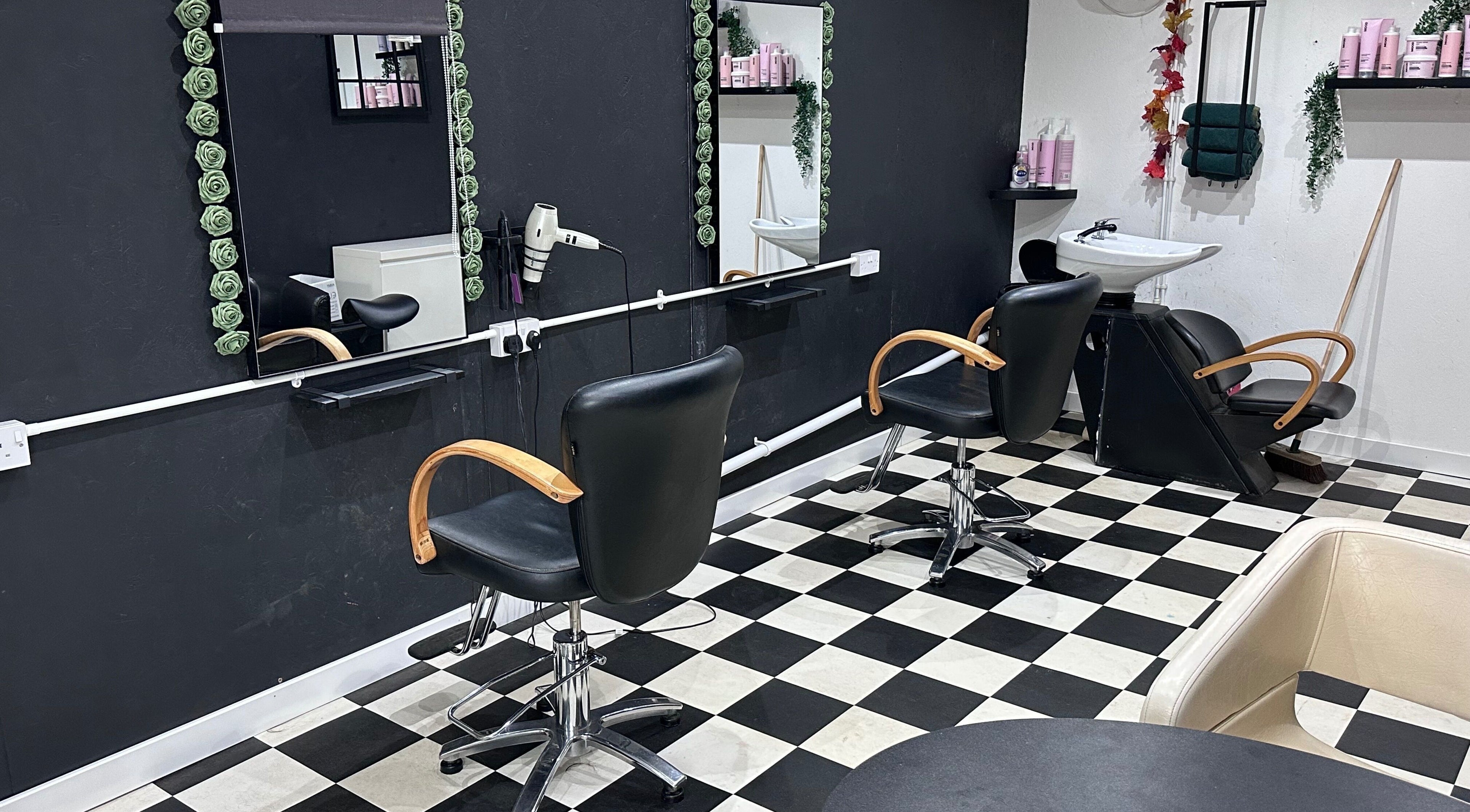 Chic interior of Locks on the Levels salon in Middlezoy, England, GB with modern black and white decor.
