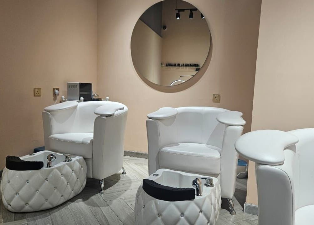 Luxurious pedicure chairs at Le Merveilleux 99 Salon, Dubai, Dubai, AE, showcasing a tranquil ambiance.