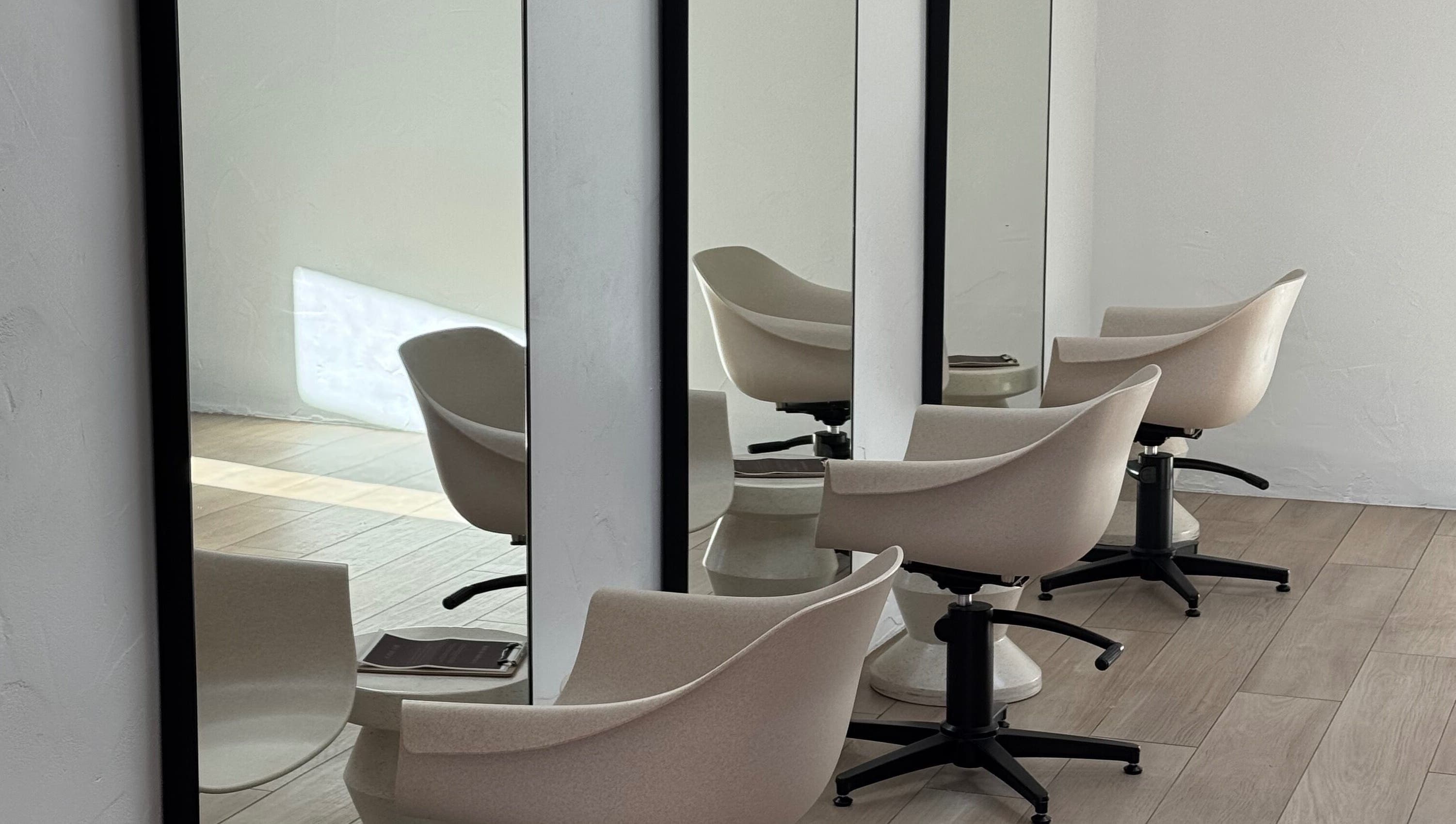Stylish hair salon chairs and mirrors at Sundae Hair in Caloundra, Queensland, AU.