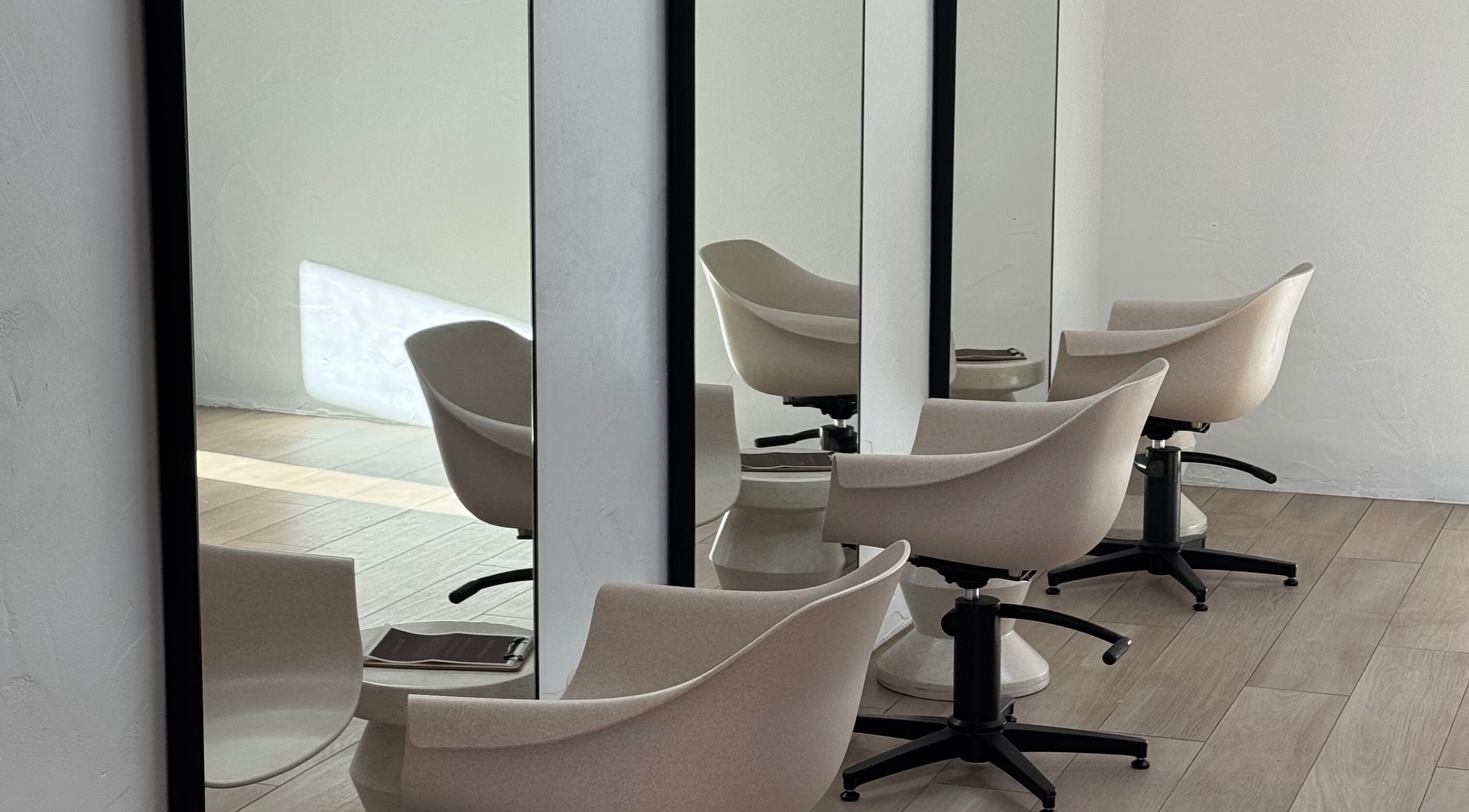 Stylish hair salon chairs and mirrors at Sundae Hair in Caloundra, Queensland, AU.