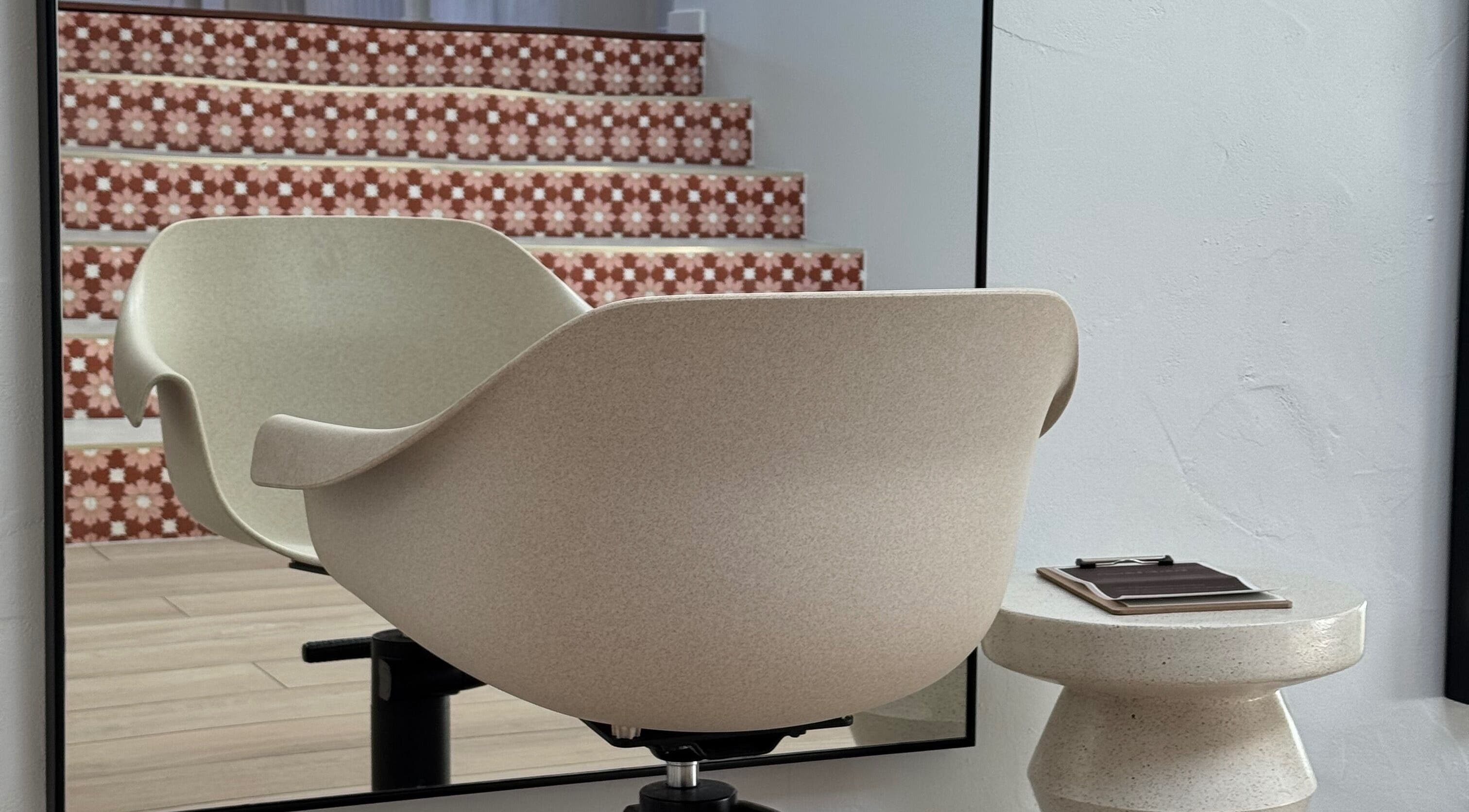 Chic salon chair and mirror at Sundae Hair, Caloundra, Queensland, AU, showcasing modern elegance.