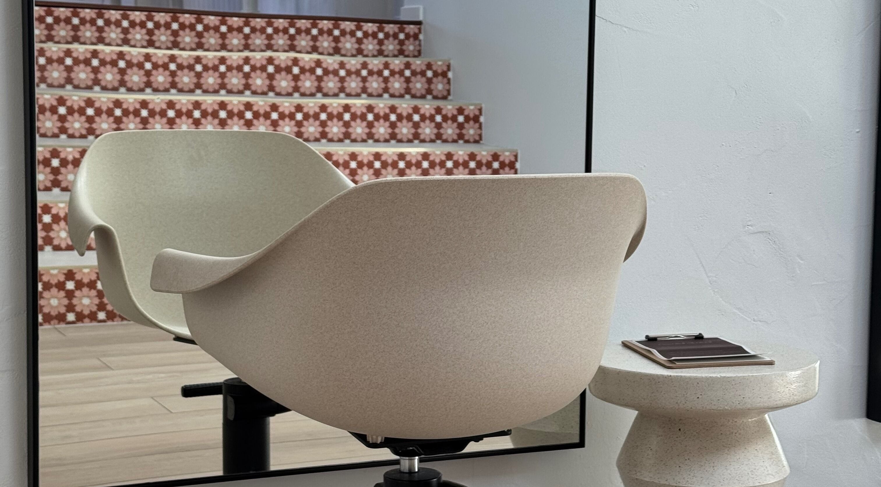 Chic salon chair and mirror at Sundae Hair, Caloundra, Queensland, AU, showcasing modern elegance.