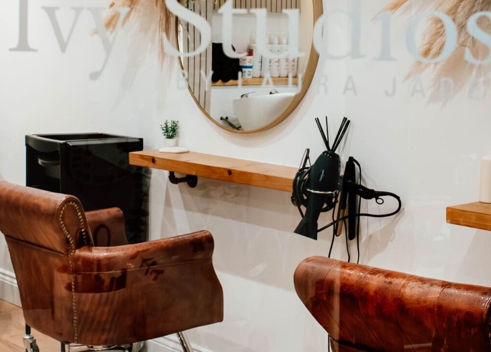 Luxurious hair salon chair and mirror setup at Ivy Studios in Ripley, England, GB, highlighting the elegant decor.