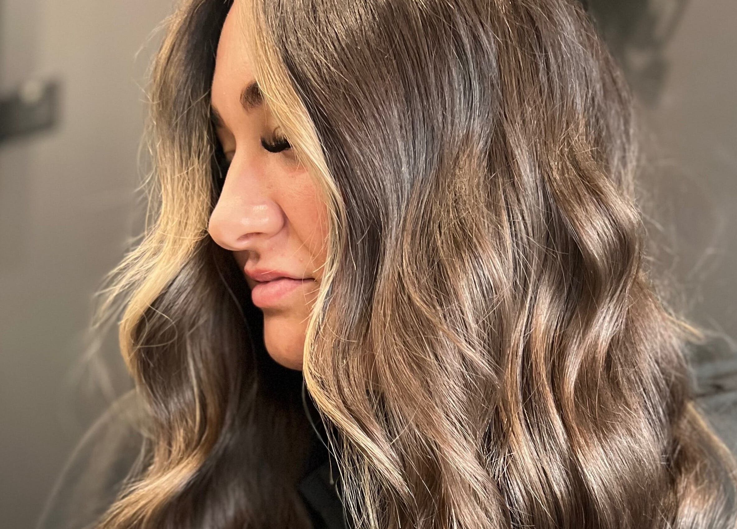 Wavy brown hairstyle at Ivy Studios in Ripley, England, GB, showcasing soft highlights and texture.