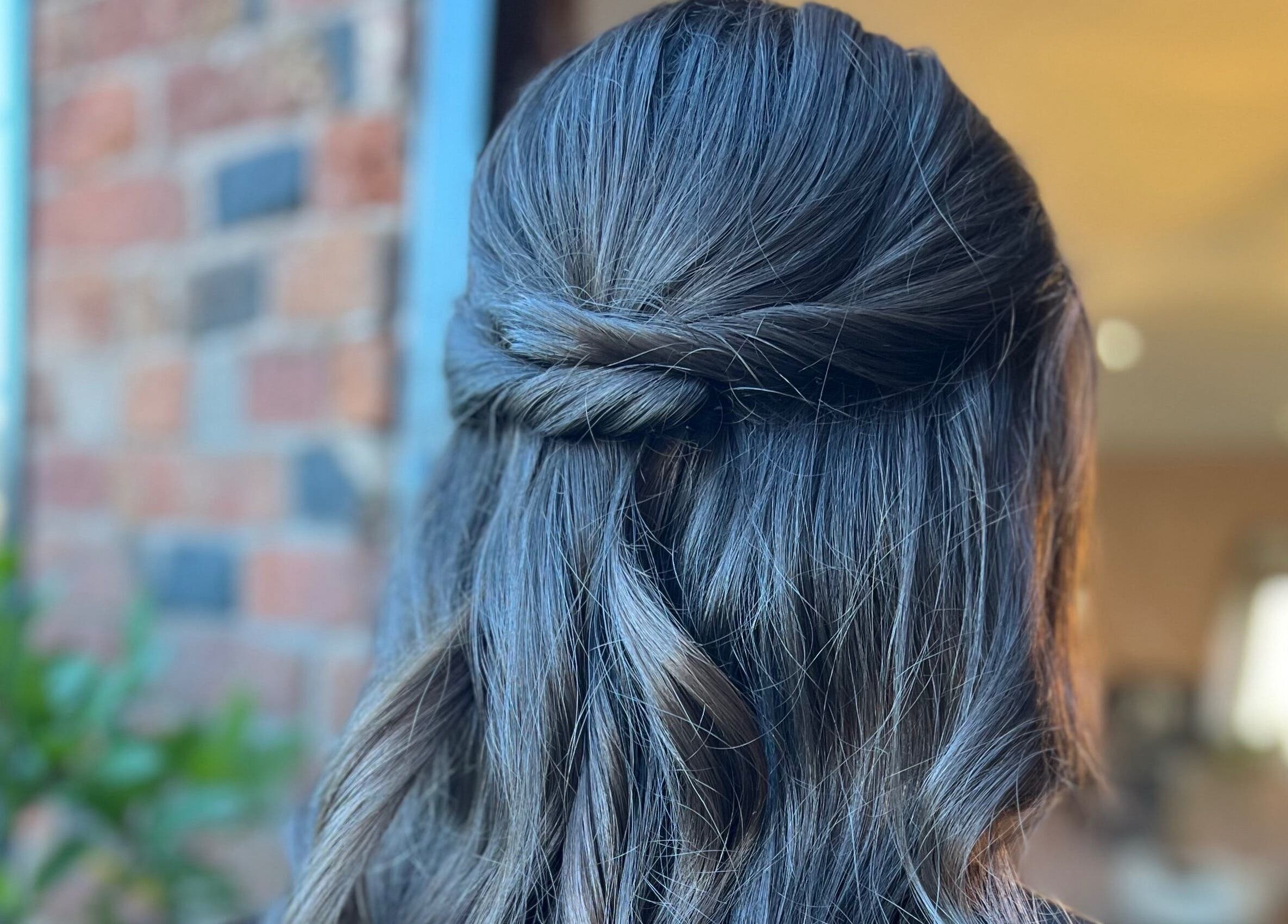 Elegant twisted hairstyle captured at Ivy Studios, Ripley, England, GB.