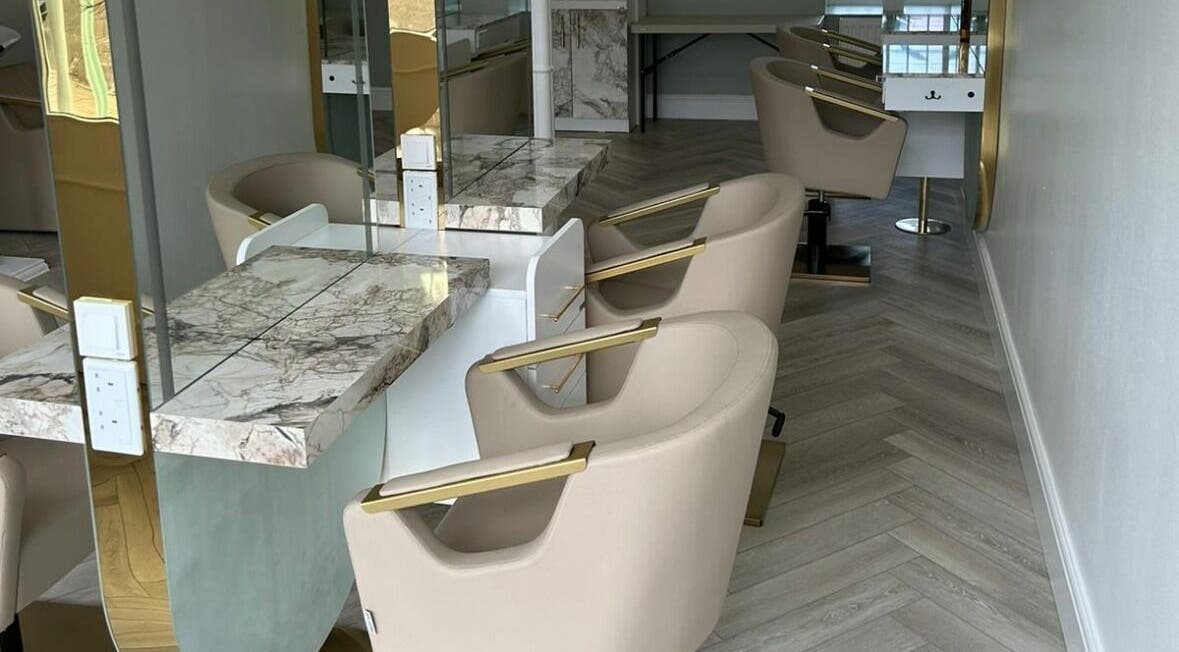 Chic salon interior with marble counters at Virtuoso Hairdressing, Musselburgh, Scotland, GB.