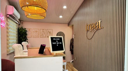 Elegant reception area of Treet Day Spa in Arima, Arima Borough Corporation, TT, featuring warm lighting and decor.