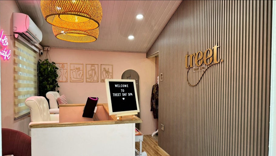 Welcoming interior of Treet Day Spa in Arima, Arima Borough Corporation, TT, featuring cozy decor and elegant lighting.