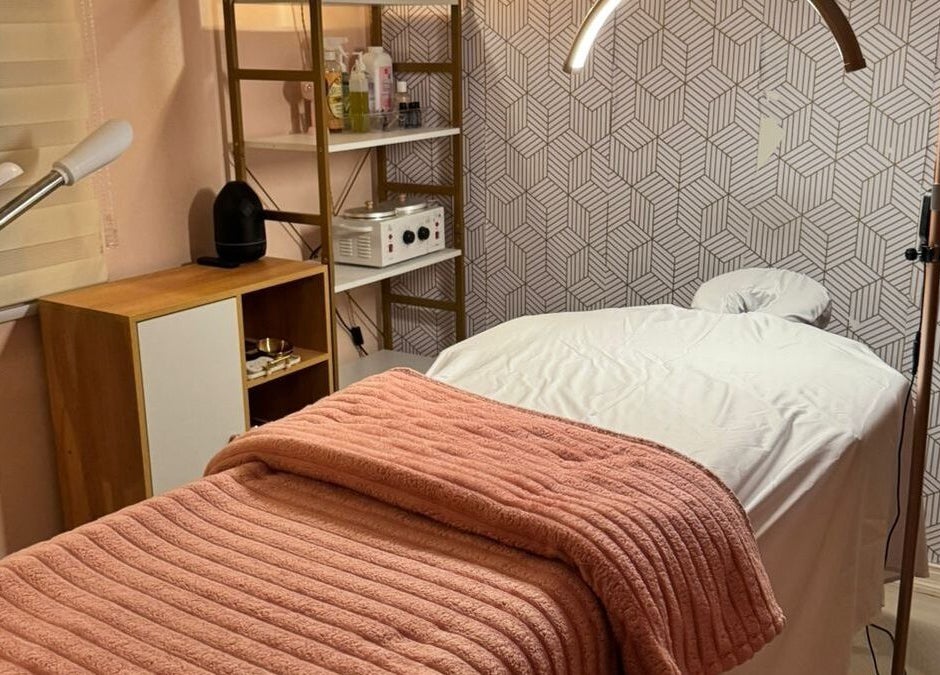 Treatment room at Treet Day Spa in Arima, Arima Borough Corporation, TT with a plush, pink blanket.