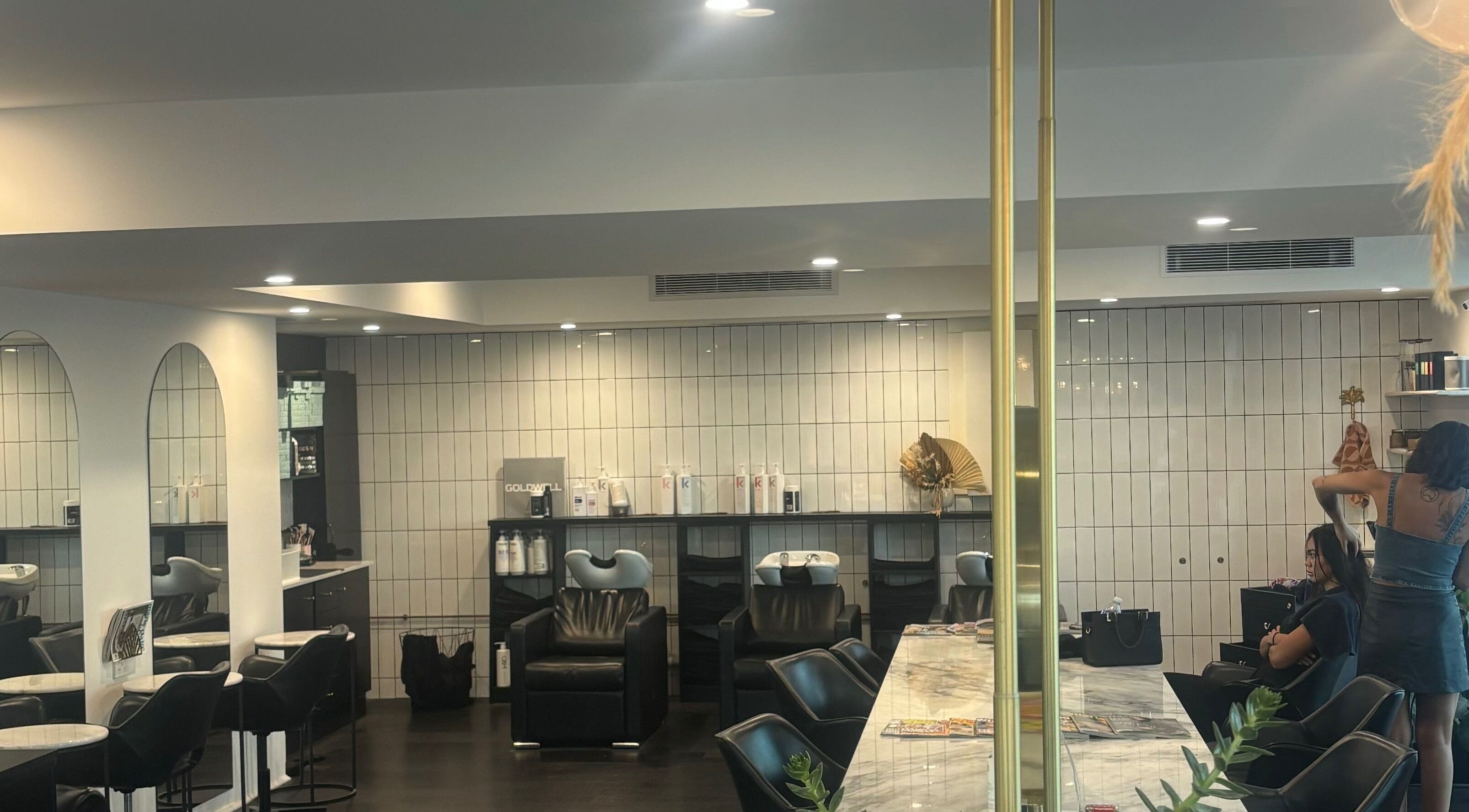 Modern salon interior at Hair by Carlene Jo in Scarborough, Western Australia, AU showcasing elegant styling stations.