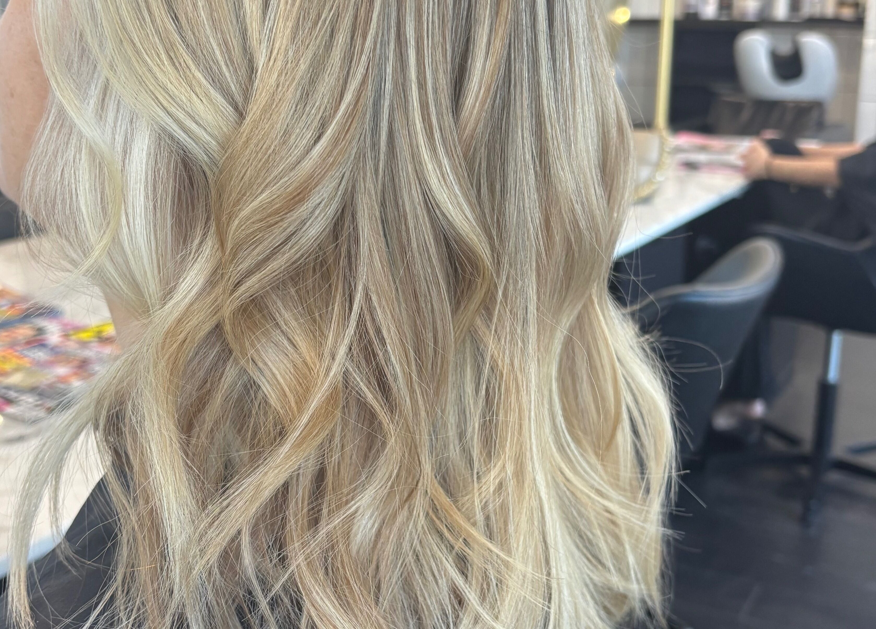 Blonde wavy hairstyle at Hair by Carlene Jo in Scarborough, Western Australia, AU.