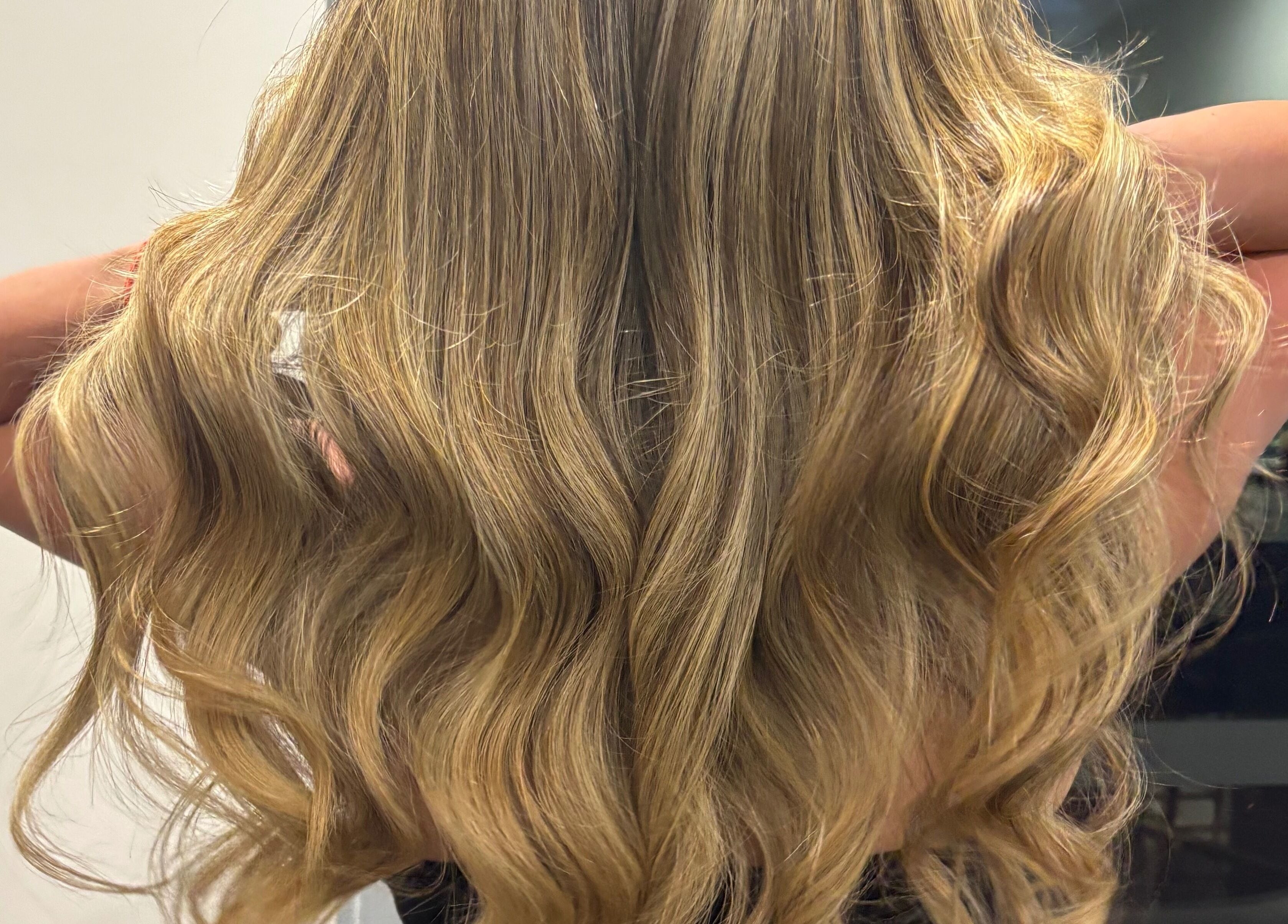 Elegant blonde waves styled at Hair by Carlene Jo, Scarborough, Western Australia, AU.