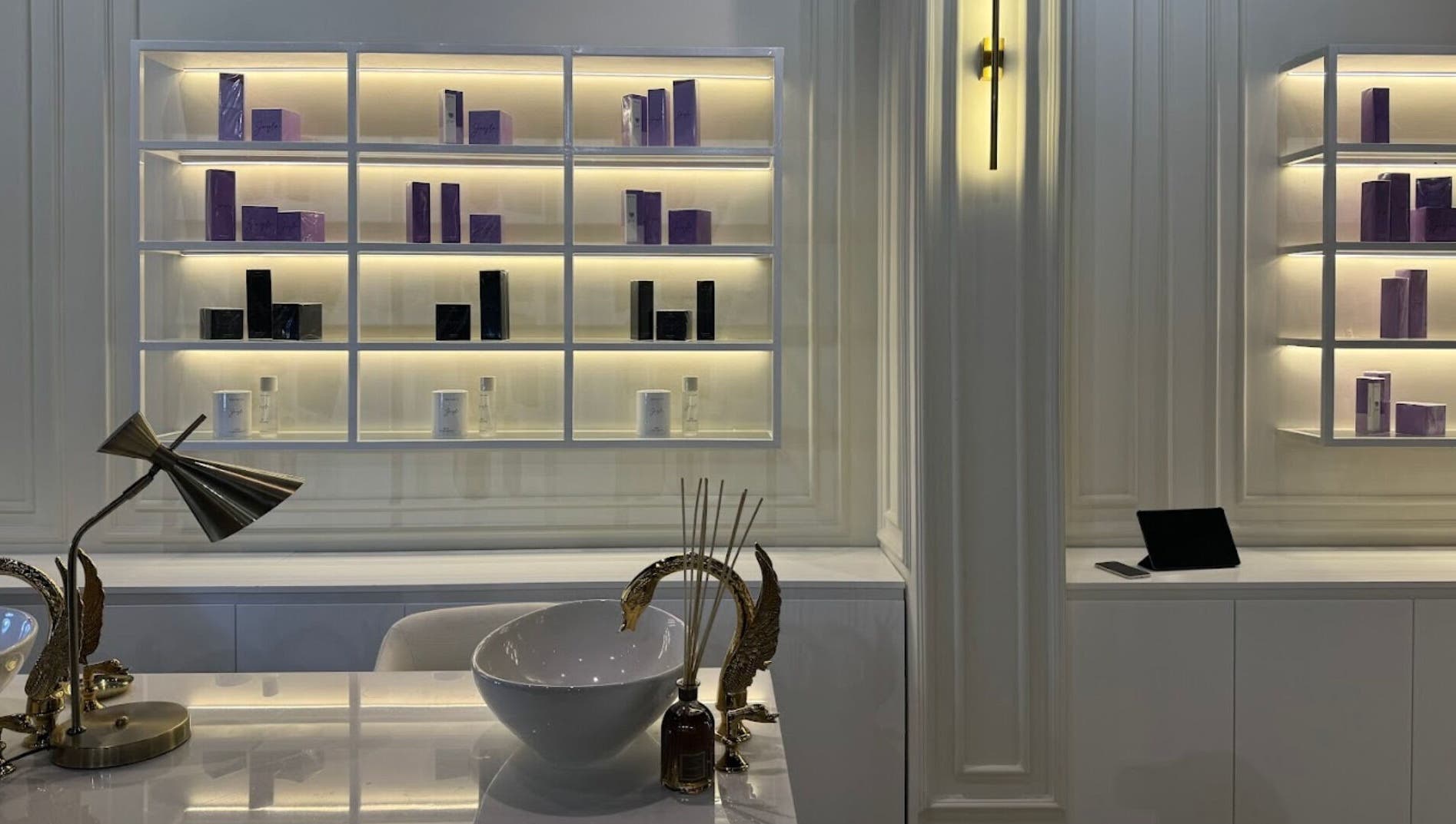 Sophisticated interior of Baran Nail Bar in Seeb, Muscat Governorate, OM with stylish shelves and decor.