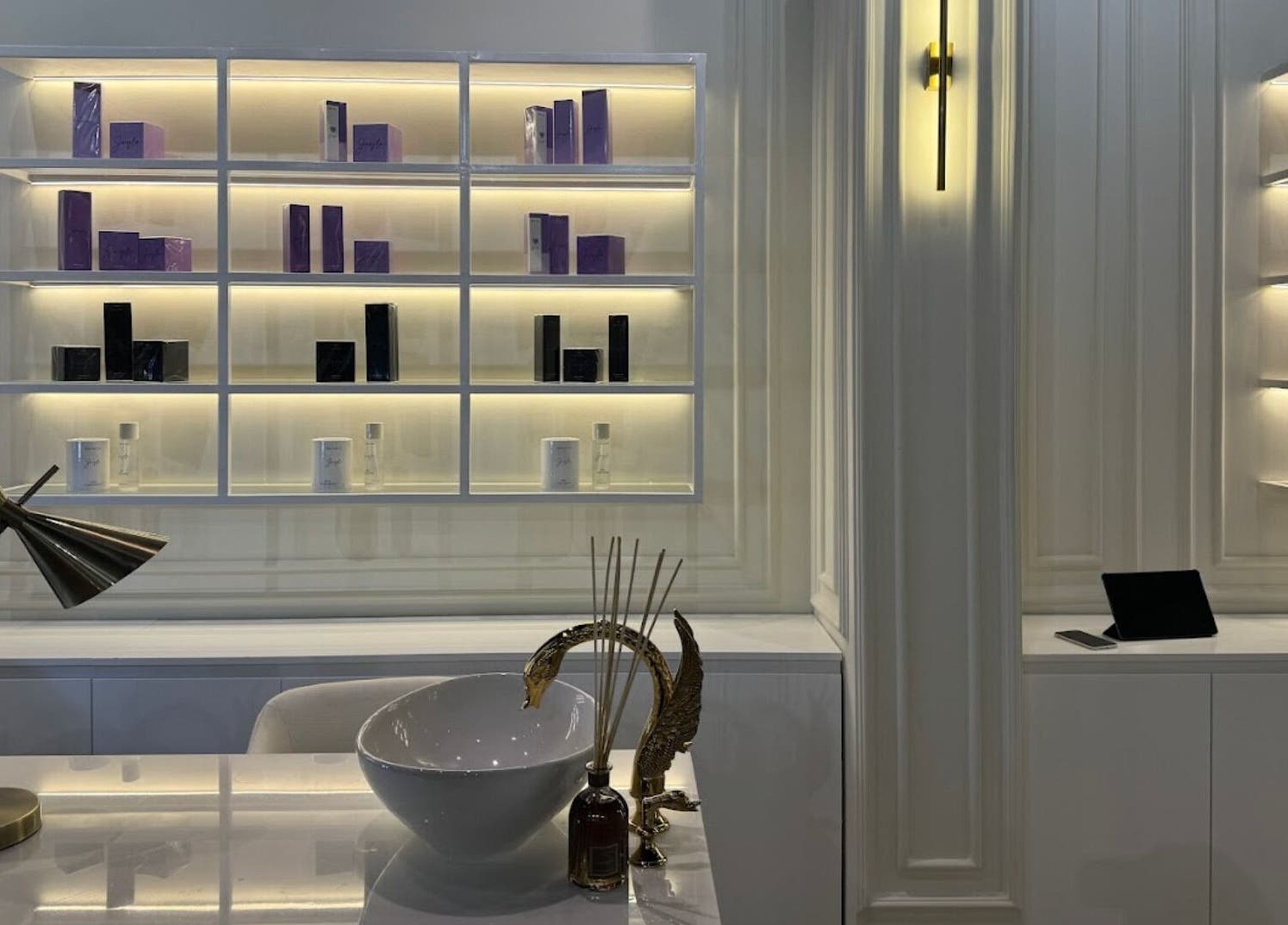 Sophisticated interior of Baran Nail Bar in Seeb, Muscat Governorate, OM with stylish shelves and decor.