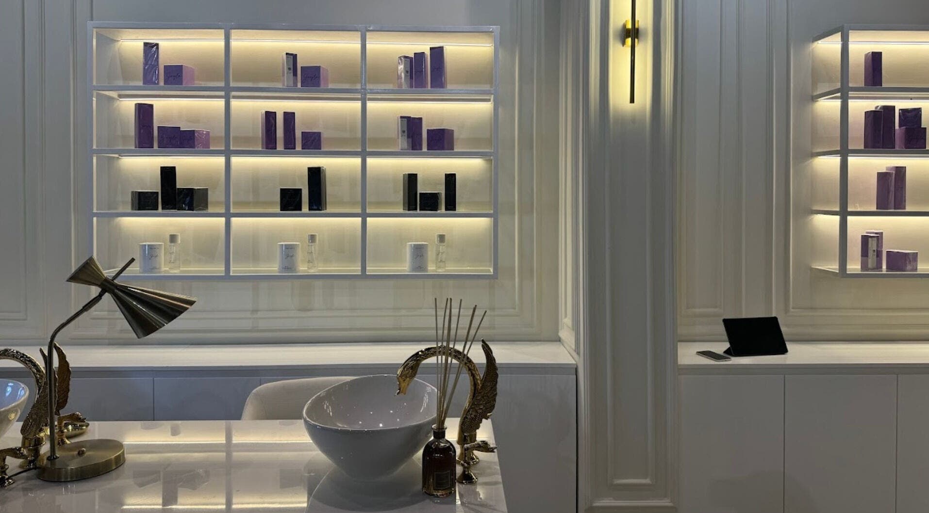 Sophisticated interior of Baran Nail Bar in Seeb, Muscat Governorate, OM with stylish shelves and decor.