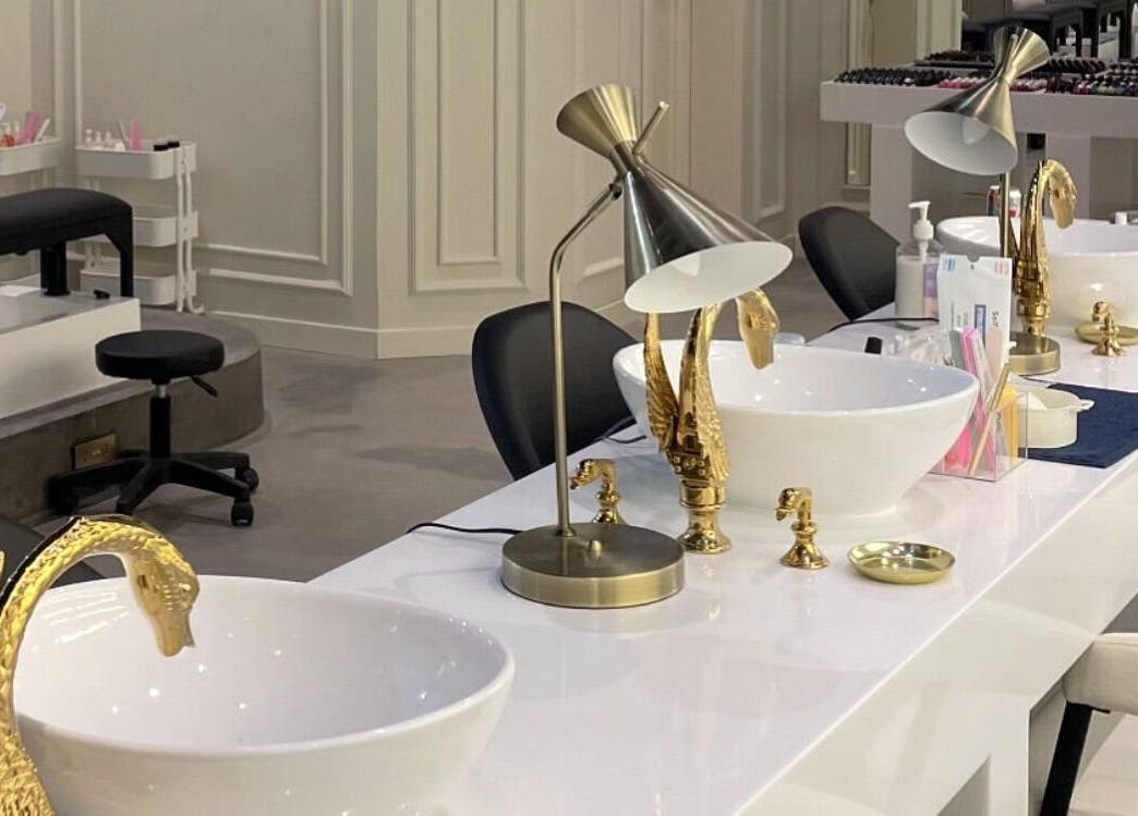 Elegant nail station at Baran Nail Bar with gold swan taps, Seeb, Muscat Governorate, OM.