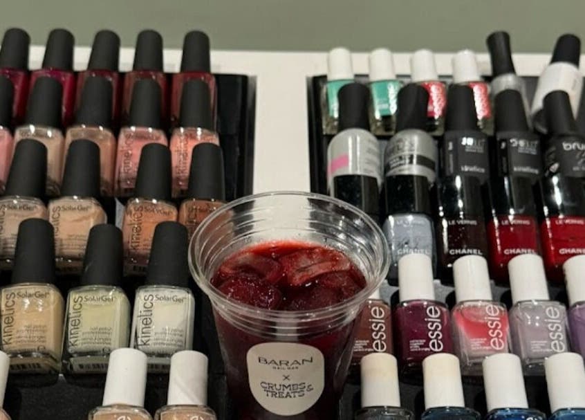 Colorful nail polish display at Baran Nail Bar, Seeb, Muscat Governorate, OM, showcasing diverse shades.
