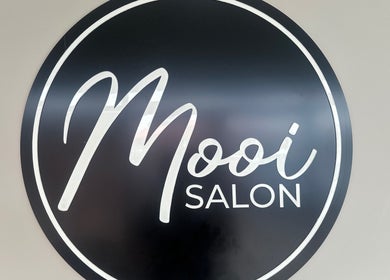 Mooi Salon logo displayed in Bloemfontein, Free State, ZA, capturing the salon's elegant branding.