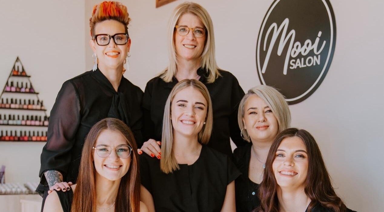 Friendly team of stylists at Mooi Salon in Bloemfontein, Free State, ZA, ready to serve clients with expert care.
