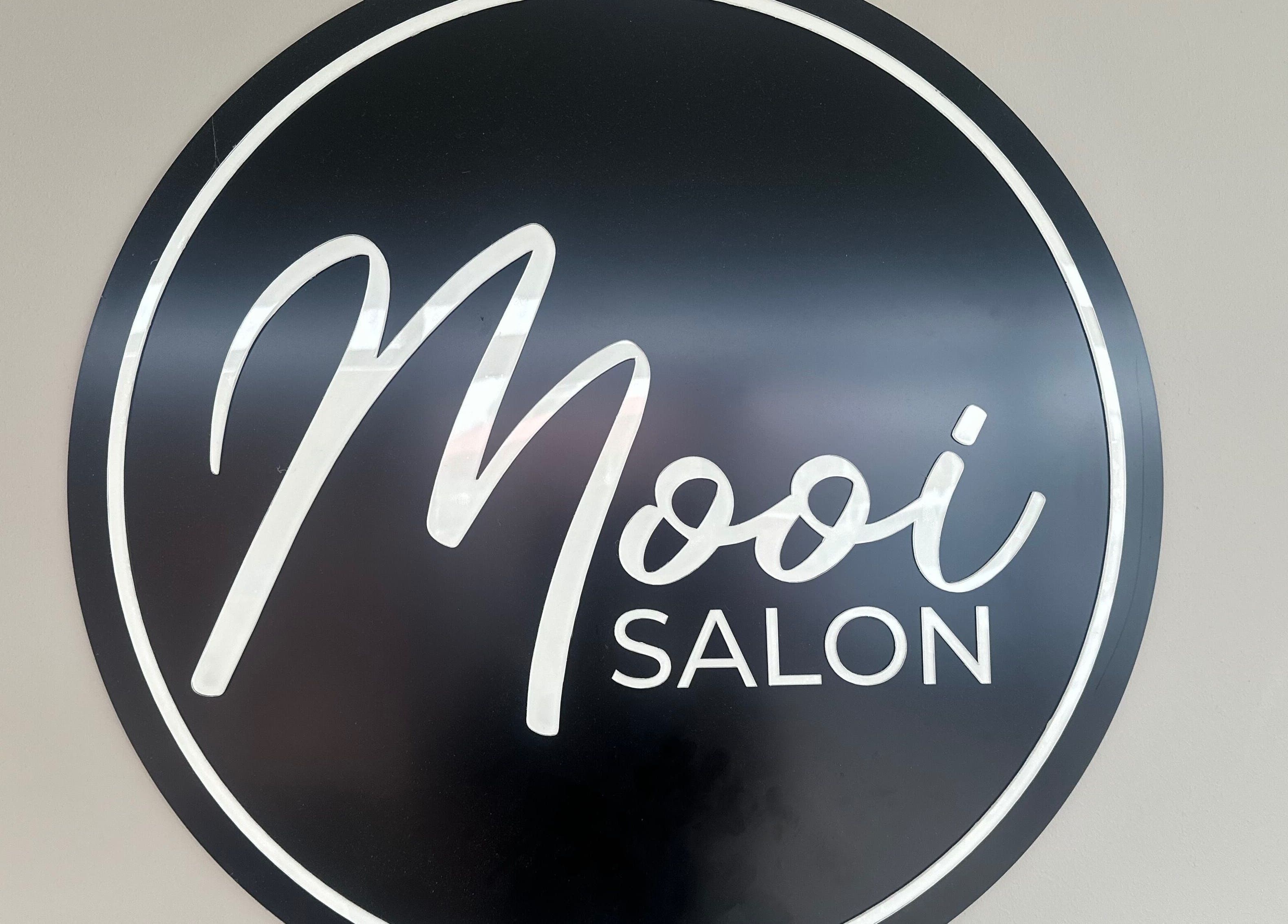 Mooi Salon stylish black circular sign displayed at Bloemfontein, Free State, ZA.