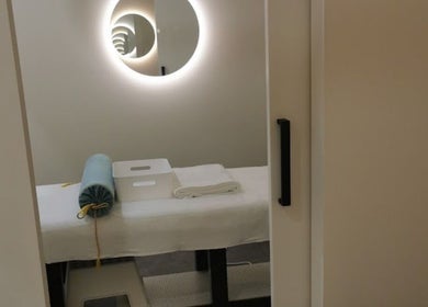 Therapy room at Kang's TCM Clinic in Runaway Bay, Queensland, AU, featuring a massage bed and soothing decor.