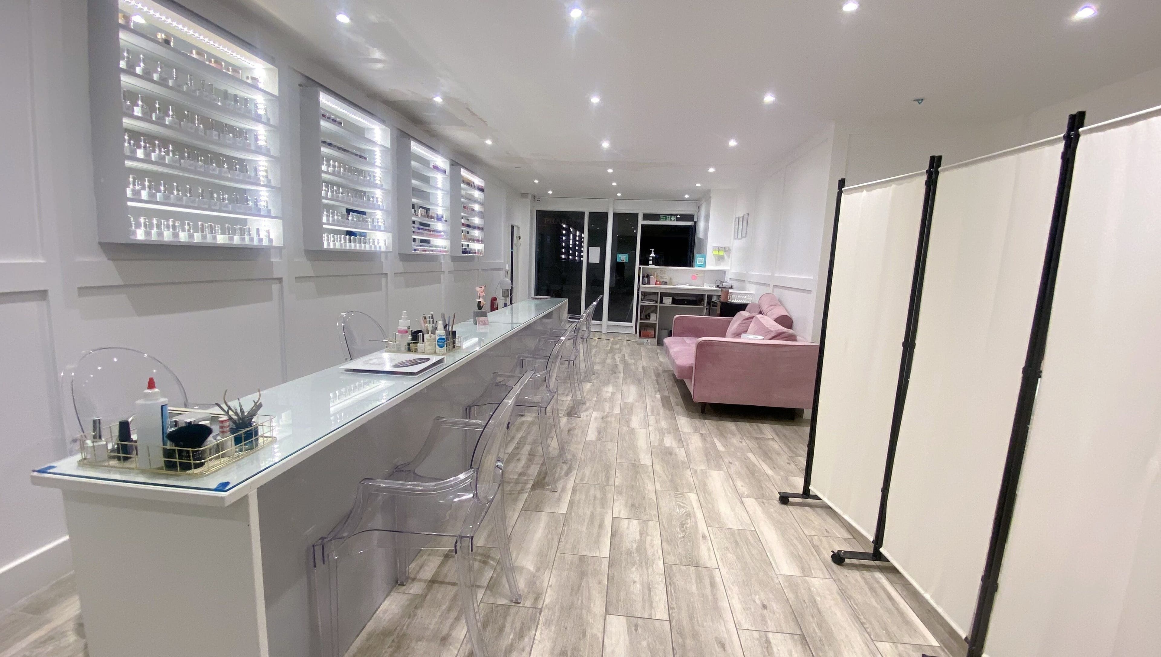 Modern nail salon interior at Jelly Nails, London, England, GB with sleek decor and comfortable seating.