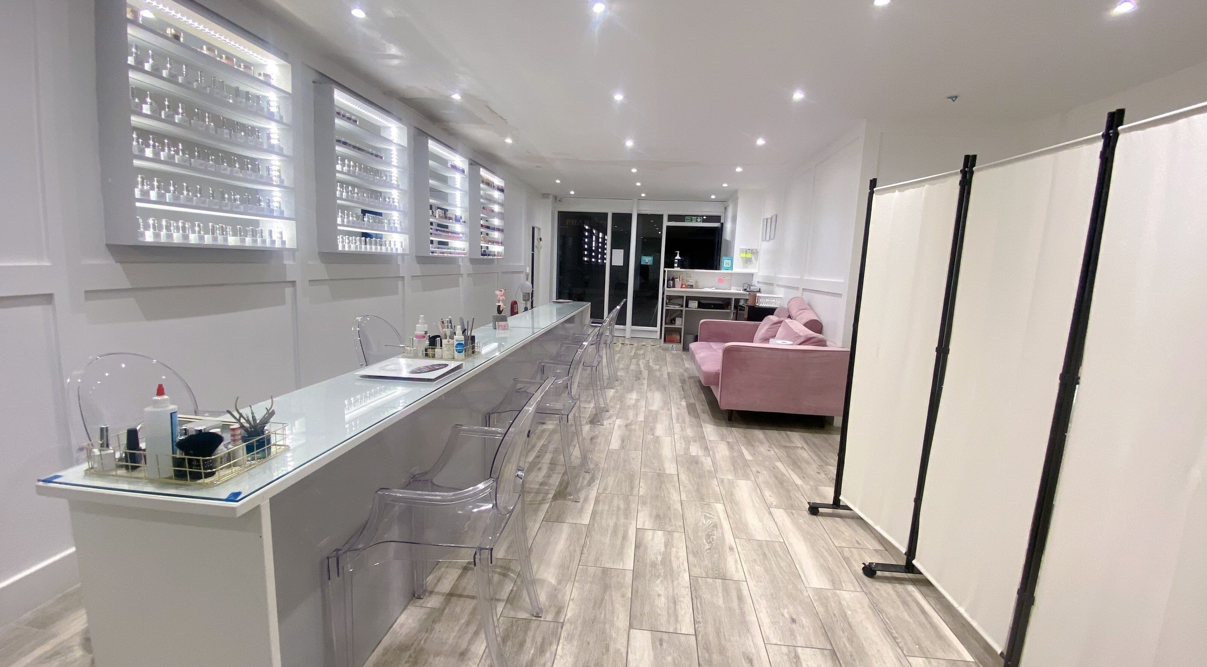 Modern nail salon interior at Jelly Nails, London, England, GB with sleek decor and comfortable seating.