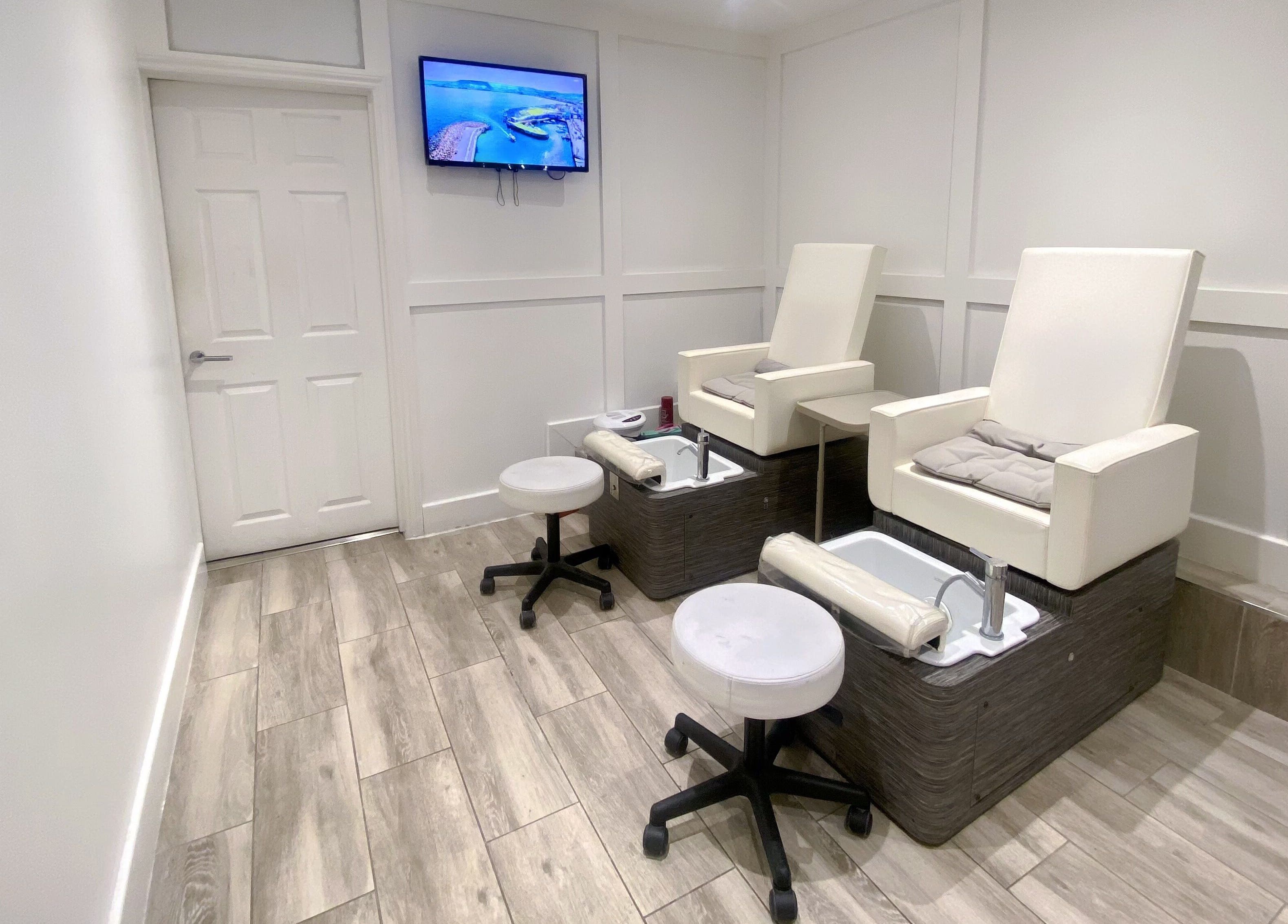 Pedicure chairs at Jelly Nails, London, England, GB offering a serene spa experience.