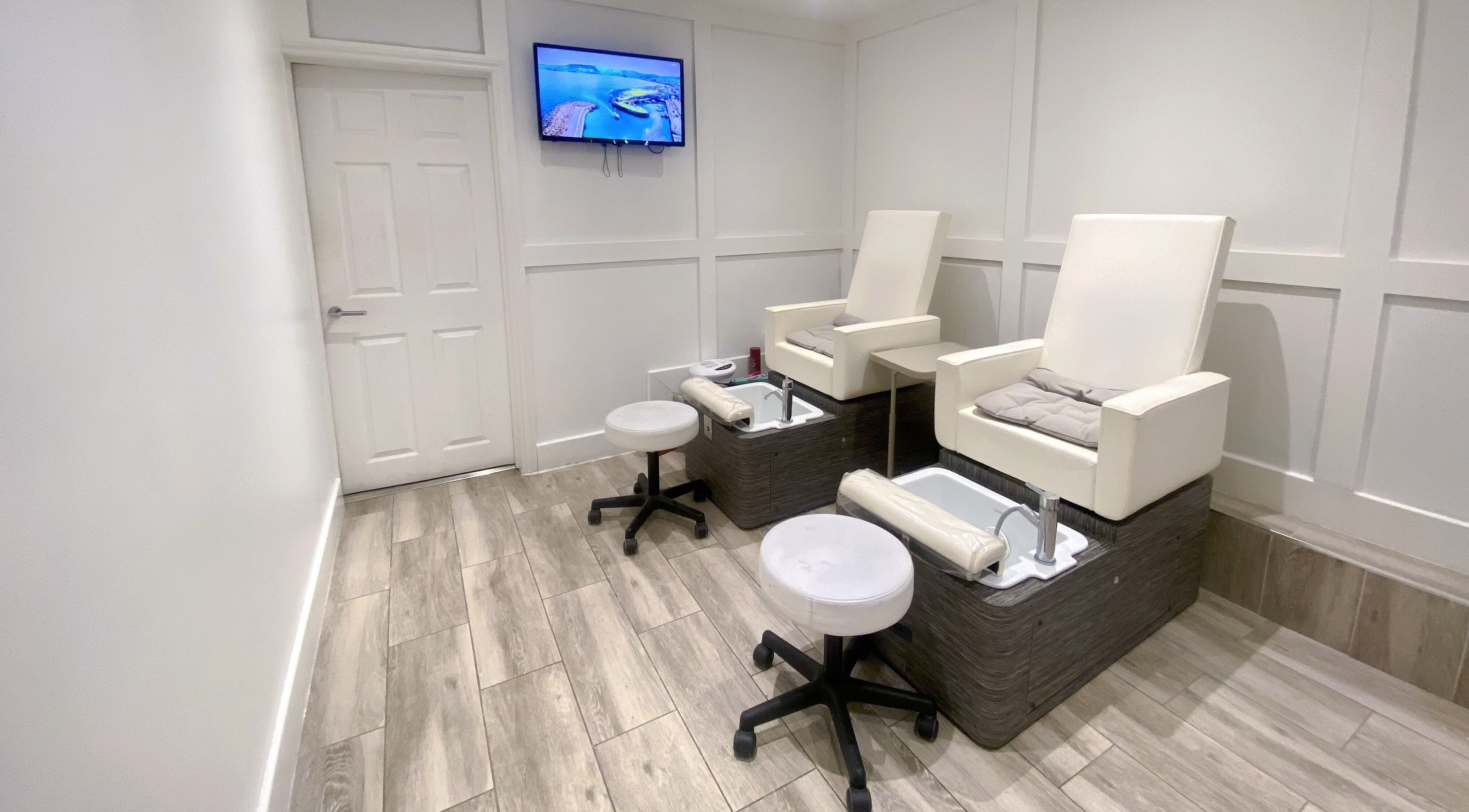 Pedicure chairs at Jelly Nails, London, England, GB offering a serene spa experience.