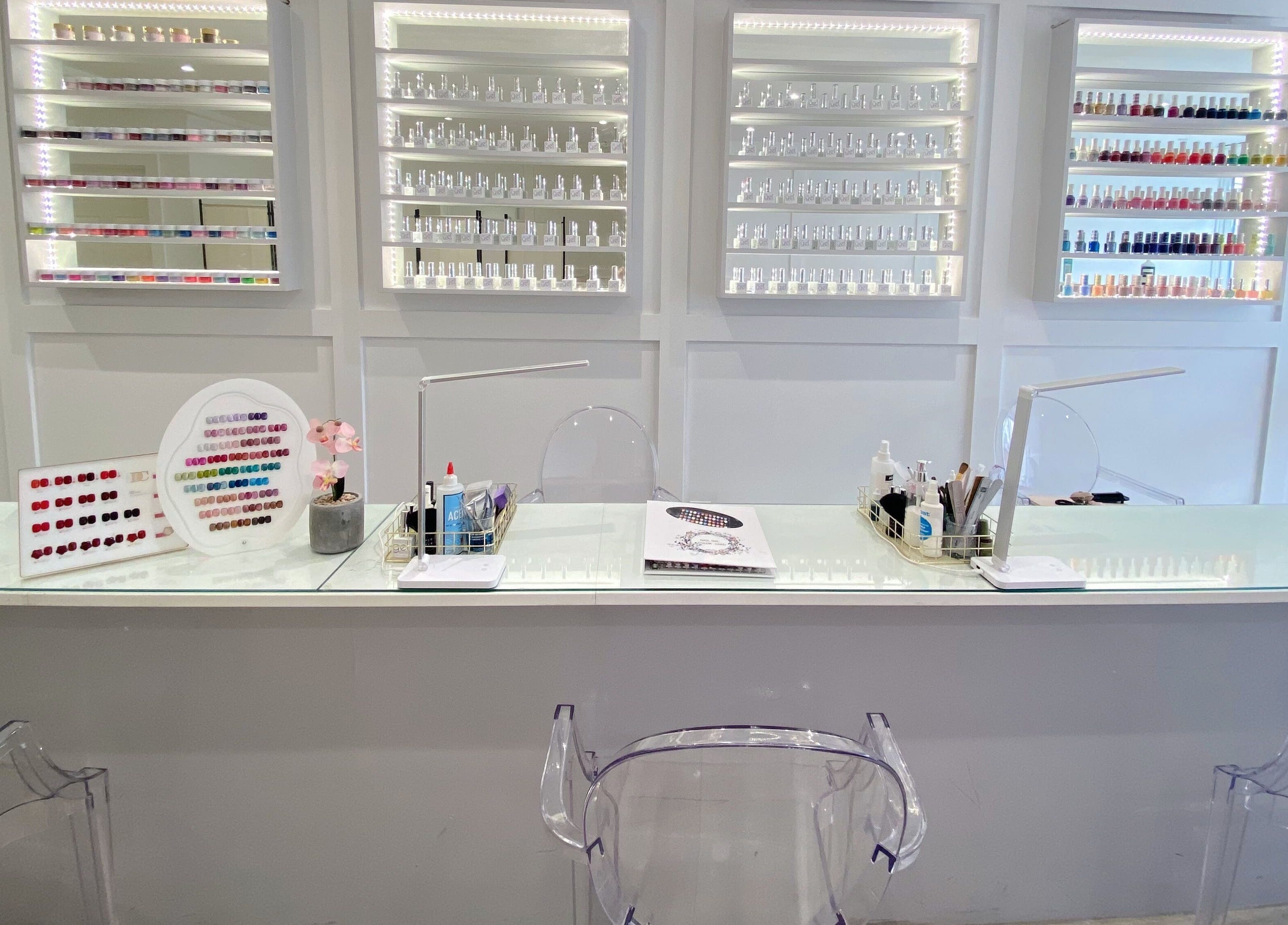 Sleek nail bar at Jelly Nails, London, England, GB, showcasing a vibrant nail polish display.