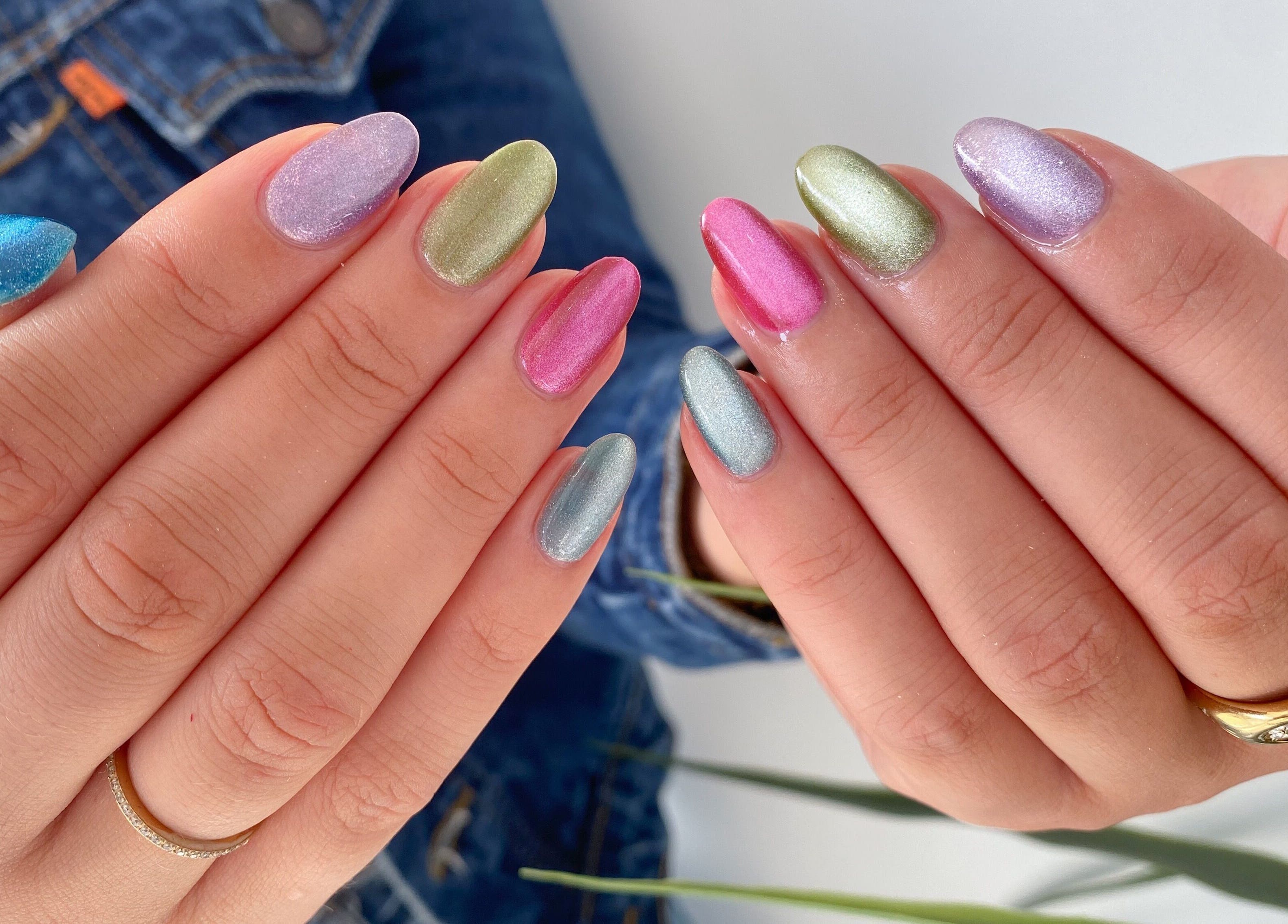 Colorful manicure at Jelly Nails in London, England, GB, showcasing vibrant, shimmering nails.