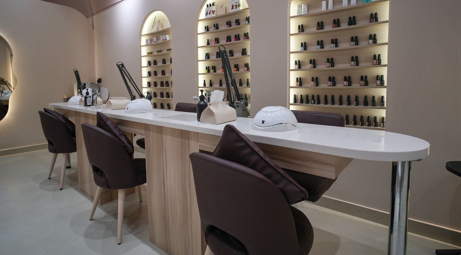 Chic nail bar at Simplice Beauty Lounge in Ras al Khaimah, AE showcasing nail polish displays.