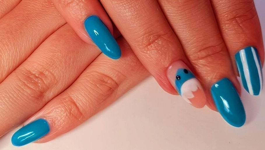 Vibrant blue nails with elegant designs at Magical Nails by Ewa in Spalding, England, GB.