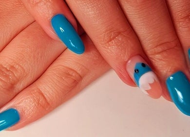 Vibrant blue nails with elegant designs at Magical Nails by Ewa in Spalding, England, GB.