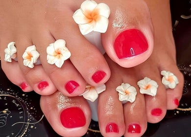 Elegant floral pedicure with red polish at Magical Nails by Ewa, Spalding, England, GB.