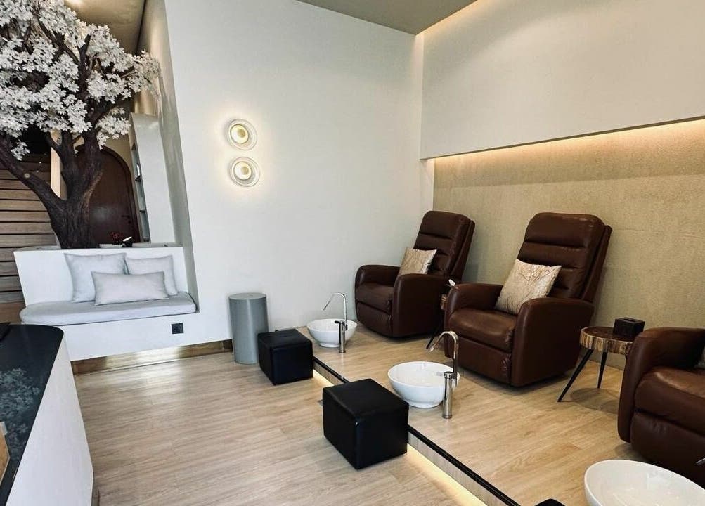 Luxurious pedicure chairs and serene decor at Anotha Beauty Salon, Dubai, AE, offering ultimate relaxation.